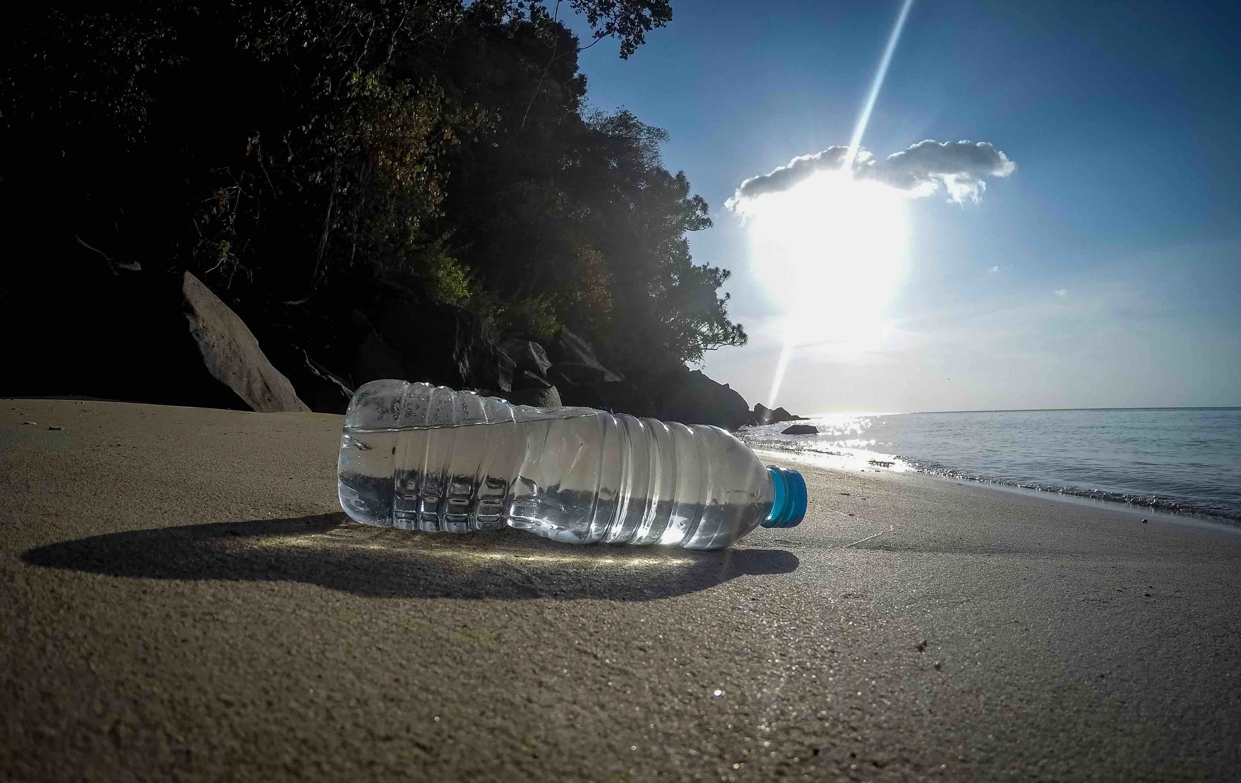 A plastic water bottle on the beach of a remote island in Indonesia. © Morrison Mast
