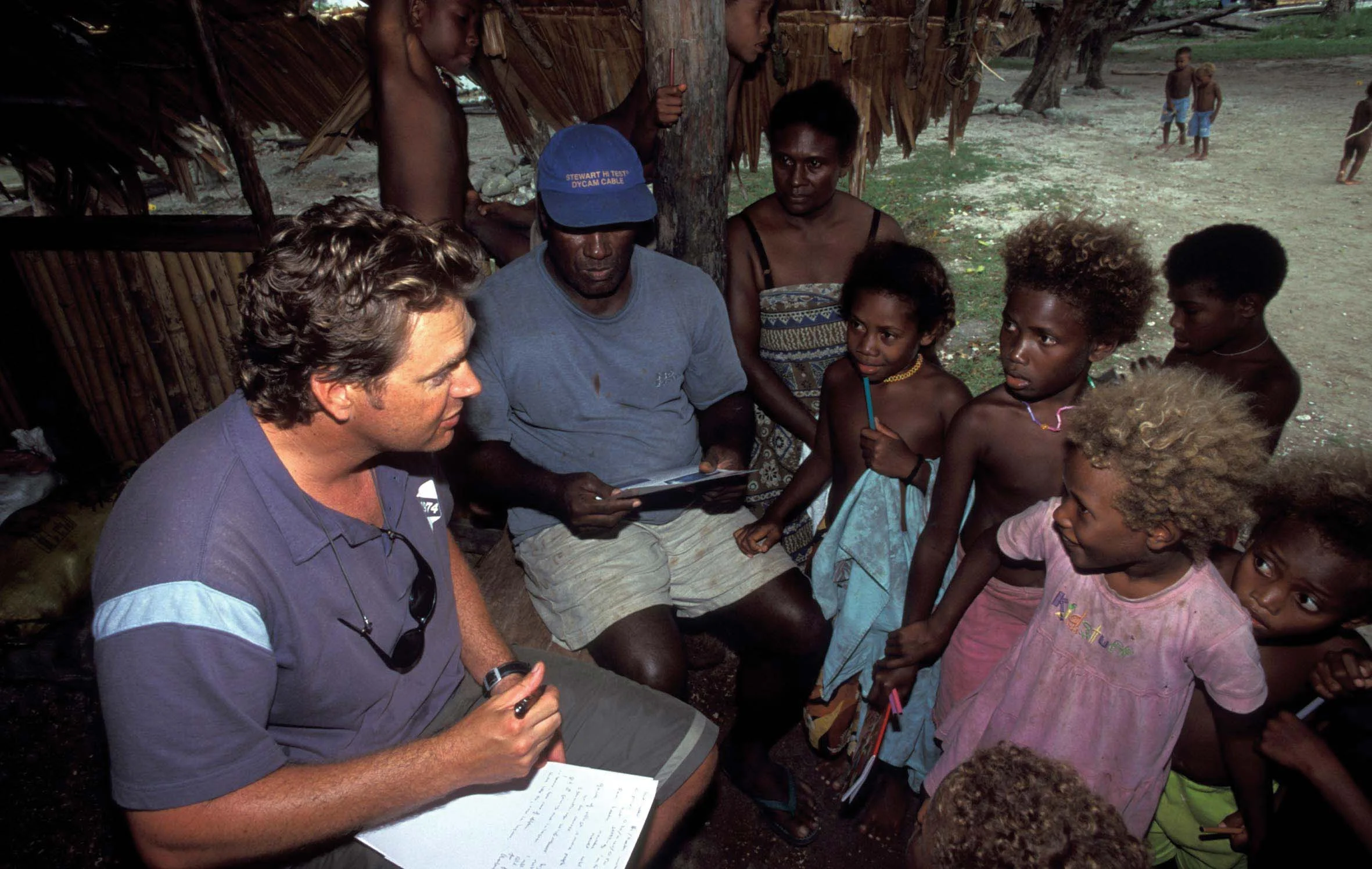 Gathering community support for conservation projects on the island of Malaita in the Solomon Islands, cetacean biologist Benjamin Kahn speaks to community members of Fanalei Village about local marine life. © DAVID WACHENFELD / TRIGGERFISH IMAGES