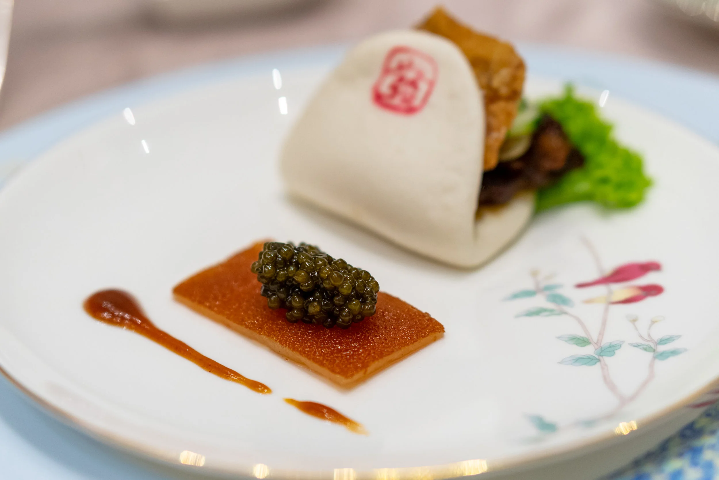 Braised and Roasted Pork Belly in Steamed Bun with Crispy Roasted Suckling Piglet Skin and Caviar