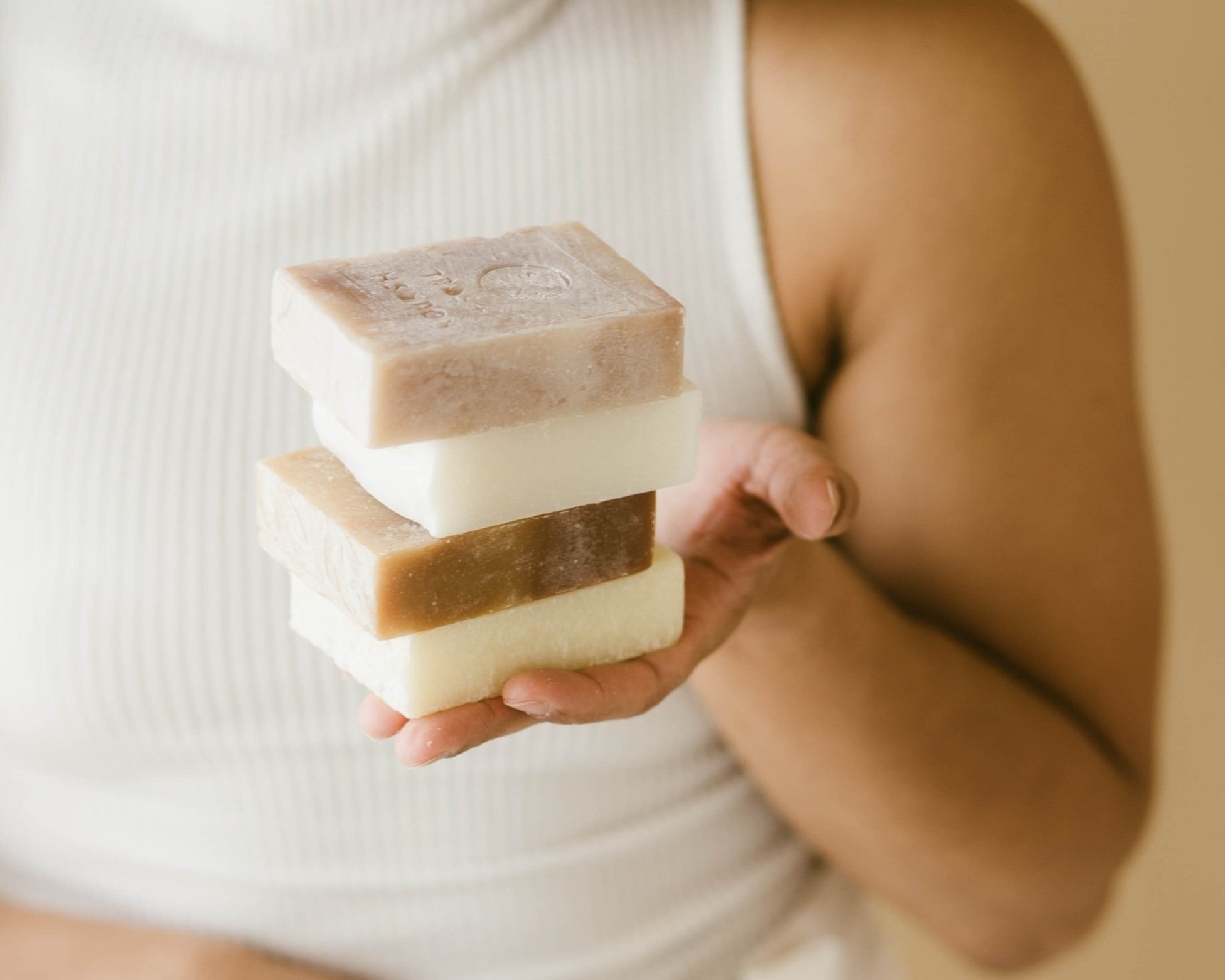 Woman holding Stack of Soap
