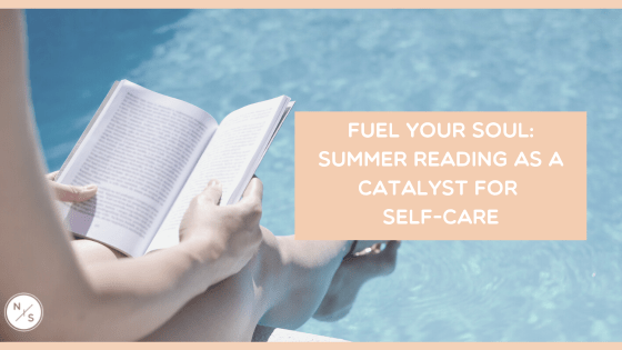Woman with feet in pool with book opened for reading