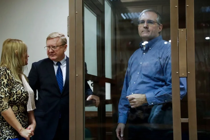 Paul Whelan, a former U.S. Marine who was arrested in Moscow at the end of last year, looks through a glass enclosure as his lawyers talk in a courtroom in Moscow on Jan. 22. (Pavel Golovkin/AP)