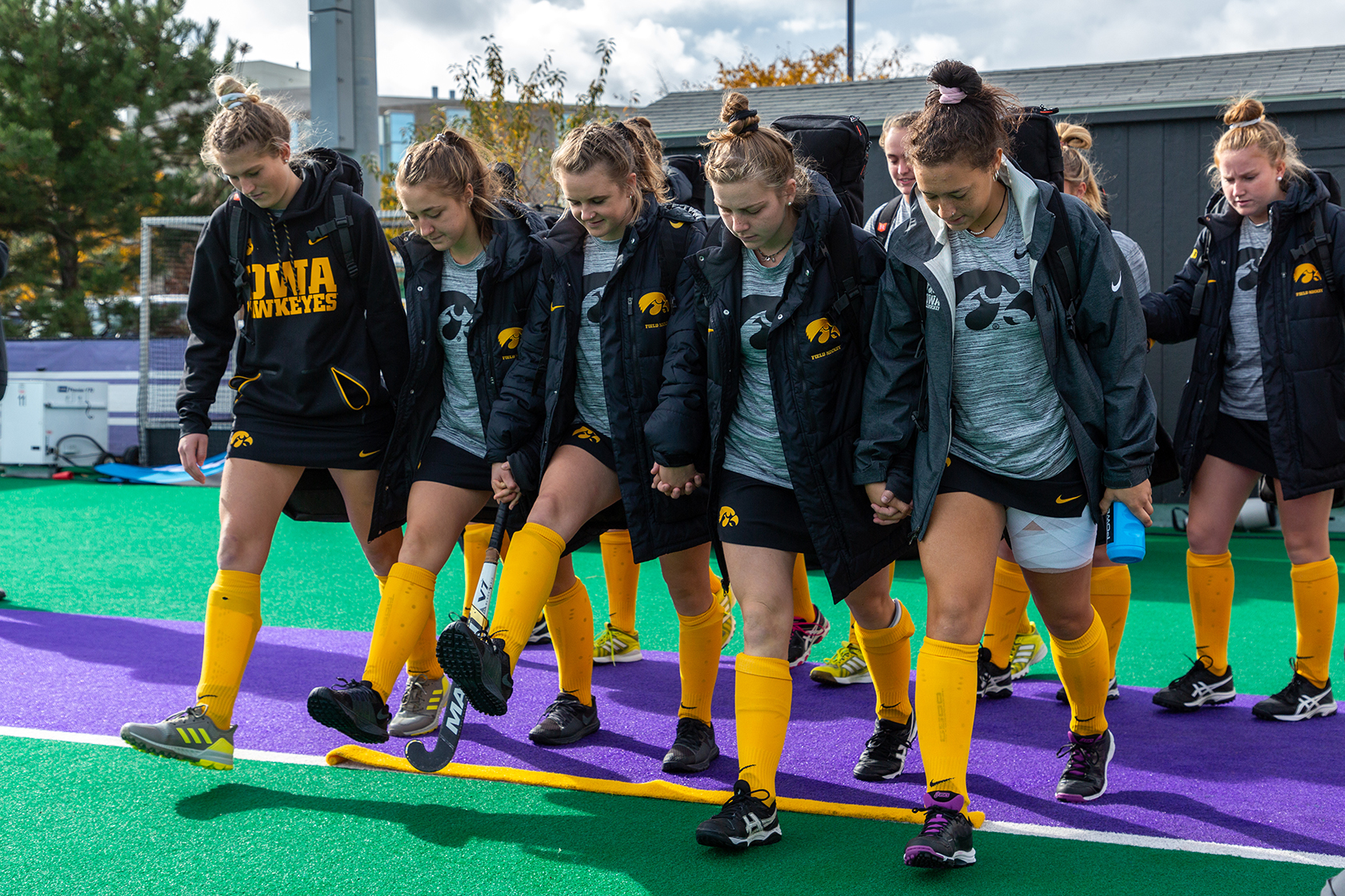  The Iowa Field Hockey Team steps over a golden stripe before the Semifinals in the Big Ten Field Hockey Tournament at Lakeside Field in Evanston, IL on Friday, Nov. 2, 2018. The no. 8 ranked Hawkeyes defeated the no. 7 ranked Wolverines 2-1. The str