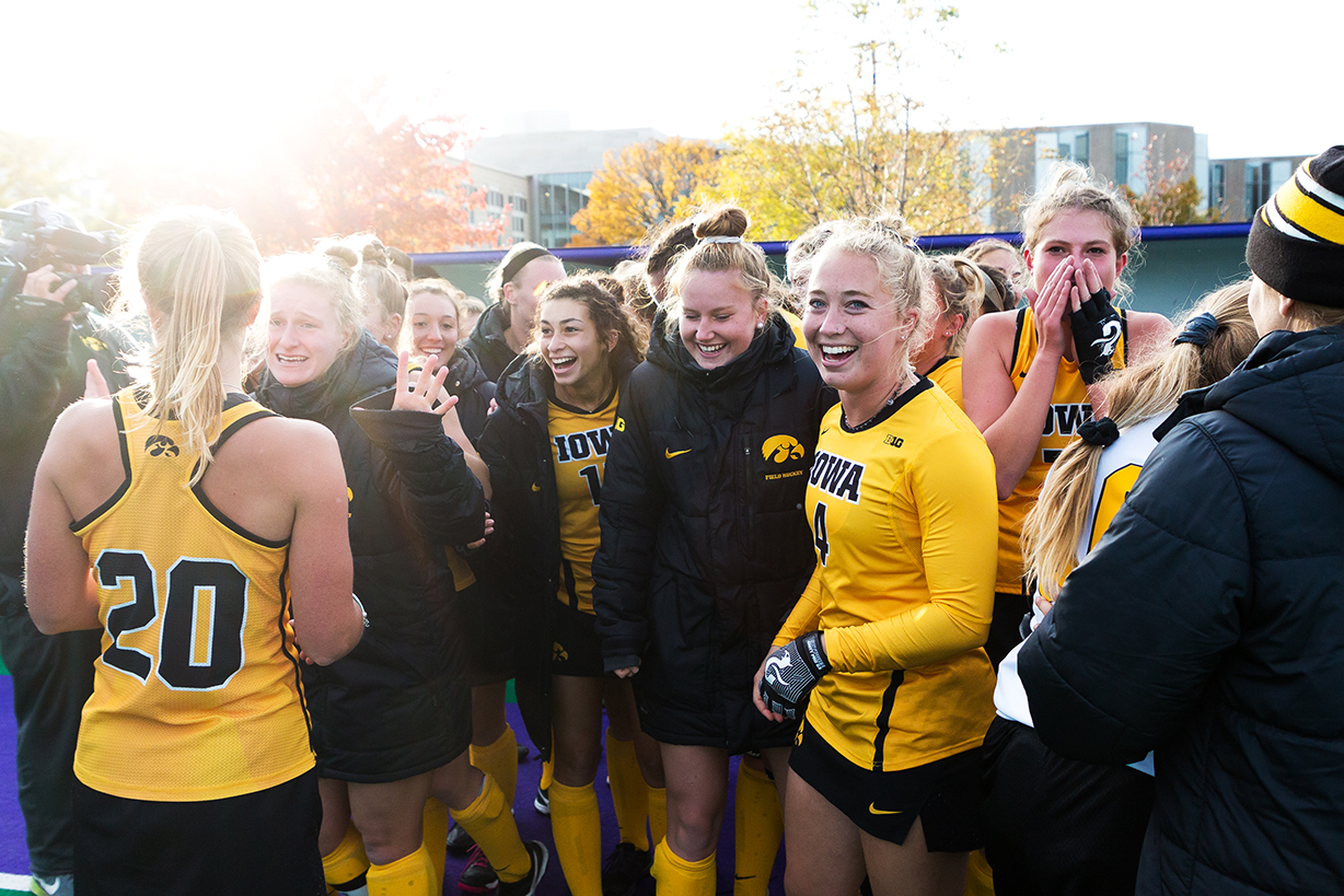  Iowa midfielder Makenna Grewe (center left) smiles as the Iowa field hockey team celebrates after the Semifinals in the Big Ten Field Hockey Tournament at Lakeside Field in Evanston, IL on Friday, Nov. 2, 2018. The no. 8 ranked Hawkeyes defeated the