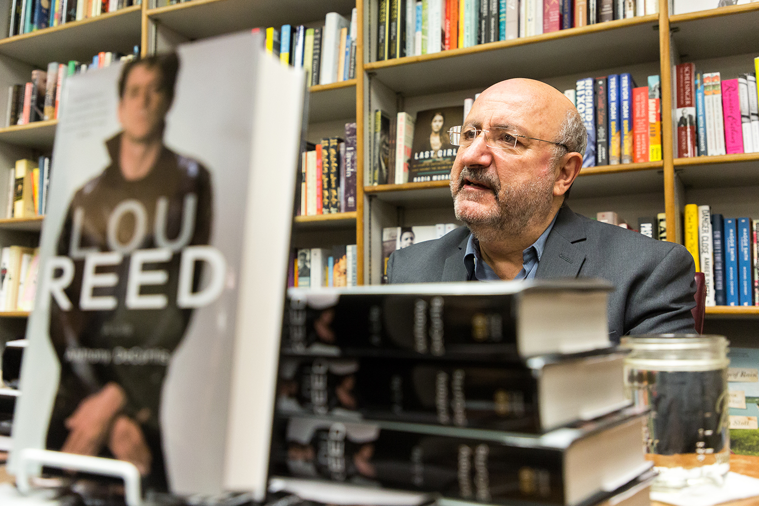  Anthony Decurtis speaks to patrons at Prairie Lights bookstore after giving a reading from and answering questions about his new biography titled “Lou Reed: A Life” on Monday, Nov. 13, 2017.  