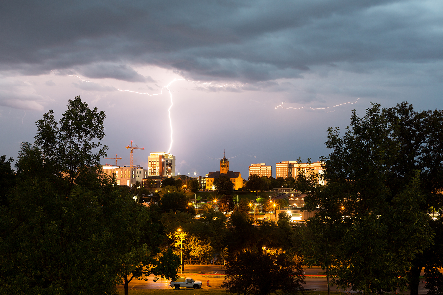  Lighting strikes a building in downtown Iowa City on Tuesday, Aug. 28, 2018.  