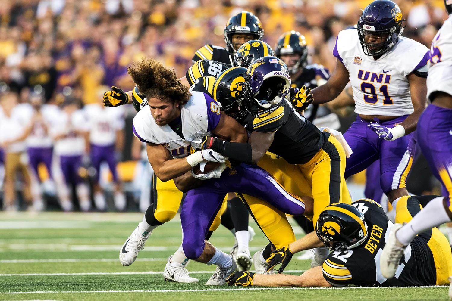 Northern Iowa Panthers punt returner Xavior Williams (9) loses his helmet as he is tackled during a game against Northern Iowa at Kinnick Stadium on Saturday, Sep. 15, 2018.