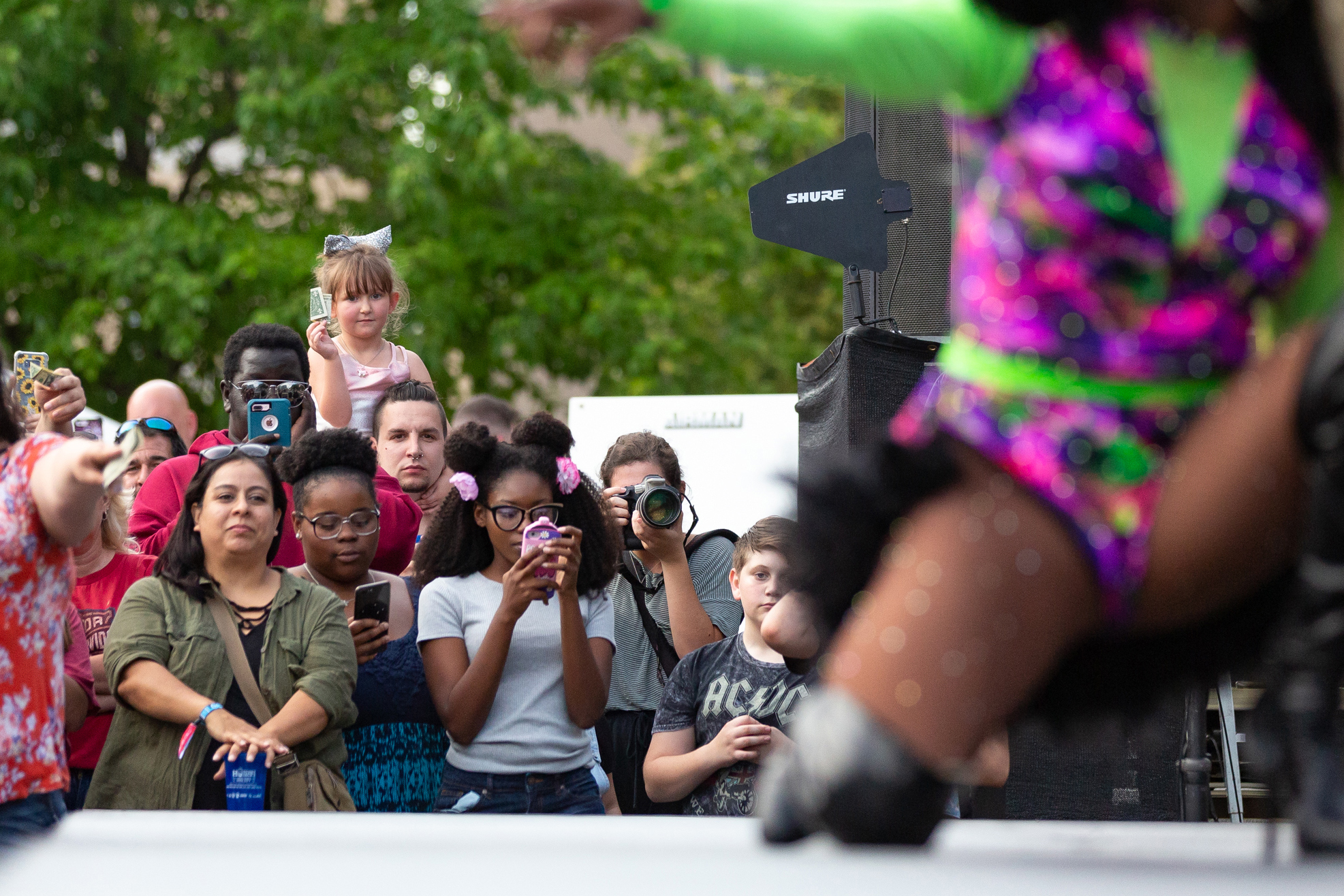  Festival goers watch a drag queen performance during the Downtown Block Party in Iowa City on Saturday, June 22, 2019.  