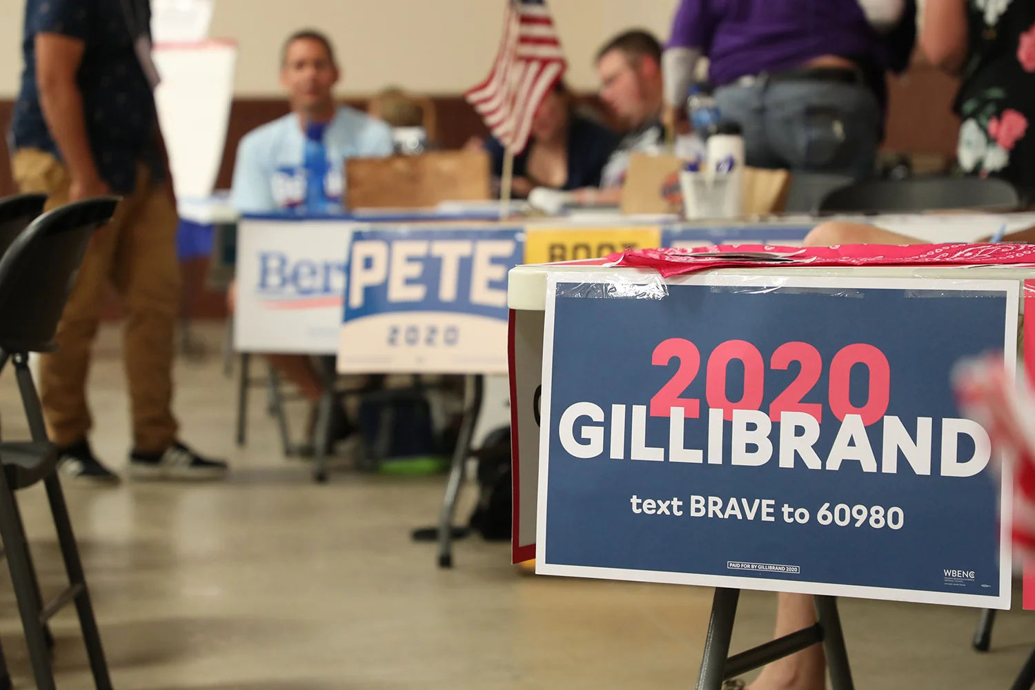 Campaign tables line the hall at the 1st District Democrats Passport to Victory rally at the Linn County Fairgrounds on Saturday, Aug. 10, 2019.