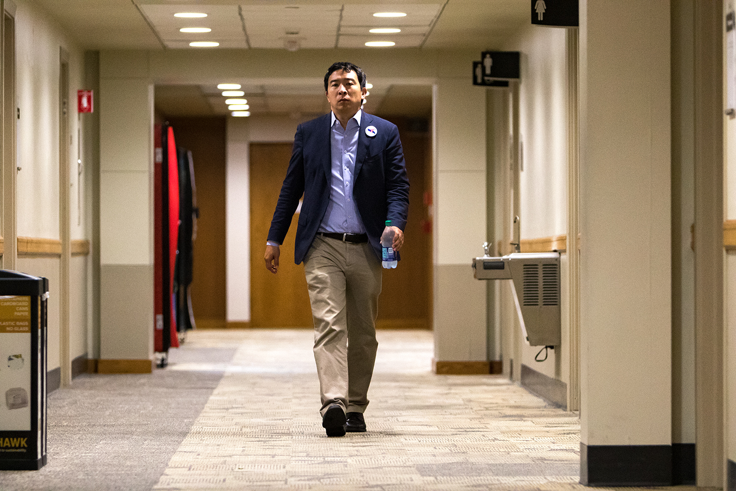  Democratic presidential candidate Andrew Yang walks down a hallway in the Iowa Memorial Union on the University of Iowa campus before an appearance sponsored by the college Democrats on Monday, Sep. 24, 2018.  