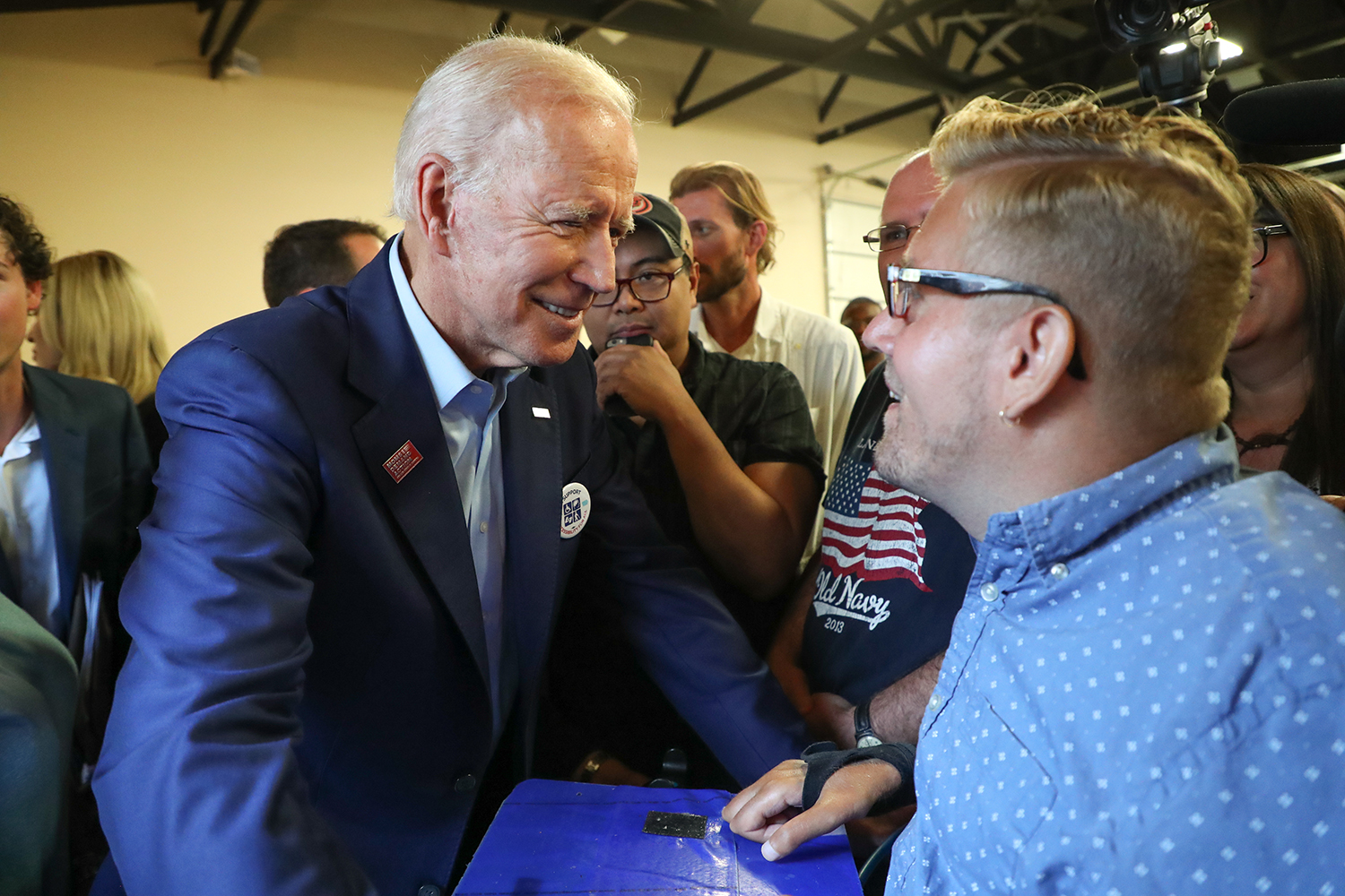  Former Vice President Joe Biden speaks with Tucker Cassidy of Waterloo at the 1st District Democrats Passport to Victory rally at the Linn County Fairgrounds on Saturday, Aug. 10, 2019.  