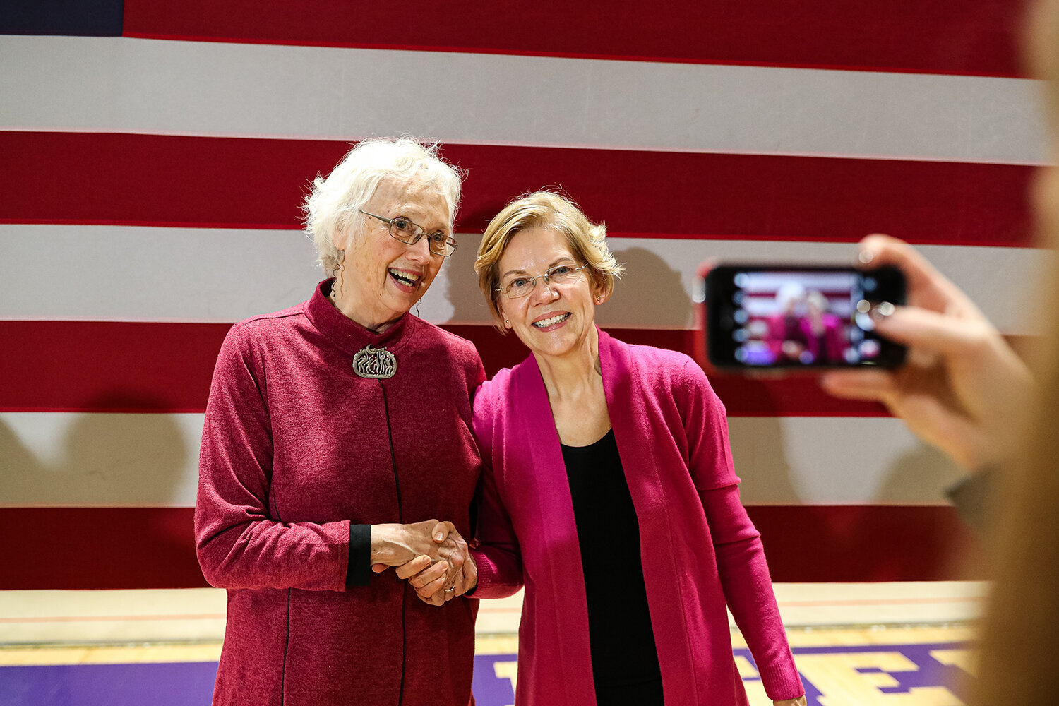  Winnie Ganshaw of Iowa City poses for a selfie with Senator Elizabeth Warren (D-MA) during a town hall rally at Taft Middle School in Cedar Rapids on Saturday, Nov. 16, 2019.  