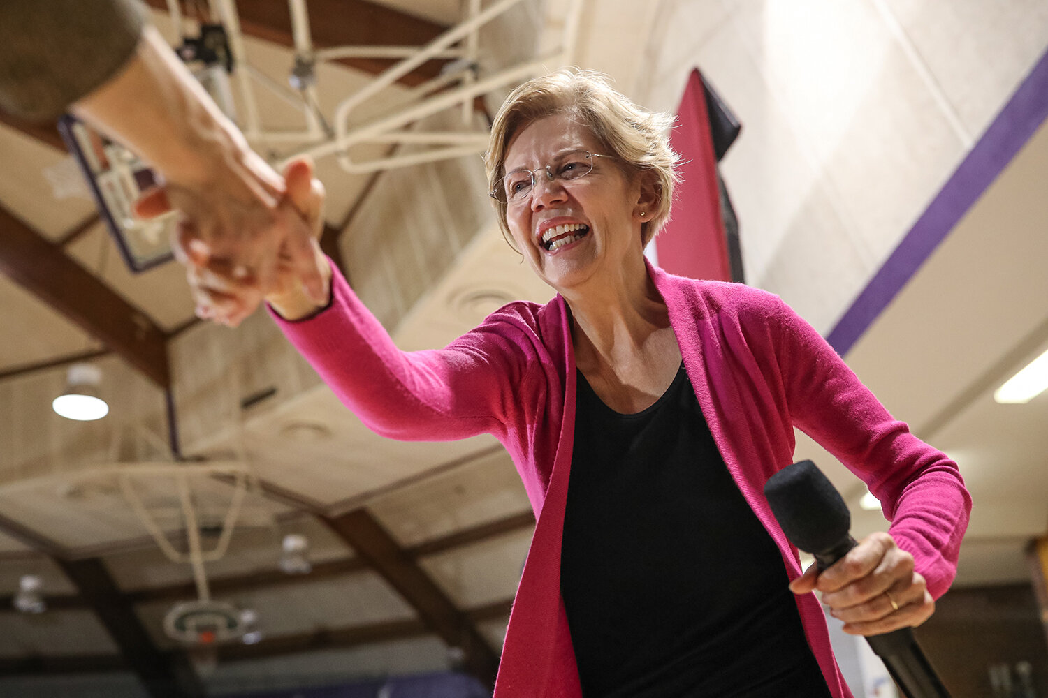  Senator Elizabeth Warren (D-MA) shakes hands with a supporter during a town hall rally at Taft Middle School in Cedar Rapids on Saturday, Nov. 16, 2019.  