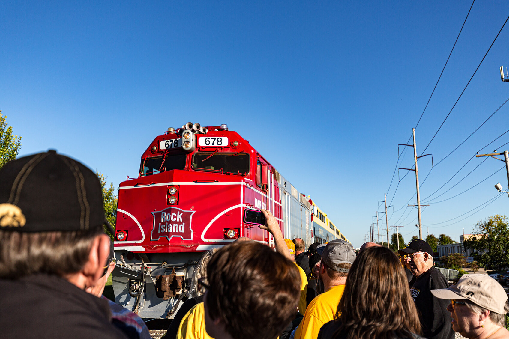  Passengers record the arrival of the Hawkeye Express in Coralville, IA on Saturday, Sep. 22, 2018.  