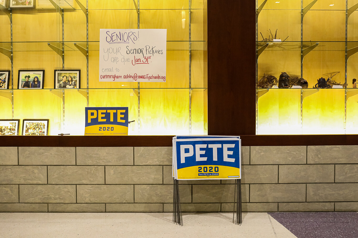  Campaign signs for Democratic presidential candidate Pete Buttigieg sit in the hallway before a campaign rally at Liberty High School in North Liberty, IA on Monday, Jan. 27, 2020.  