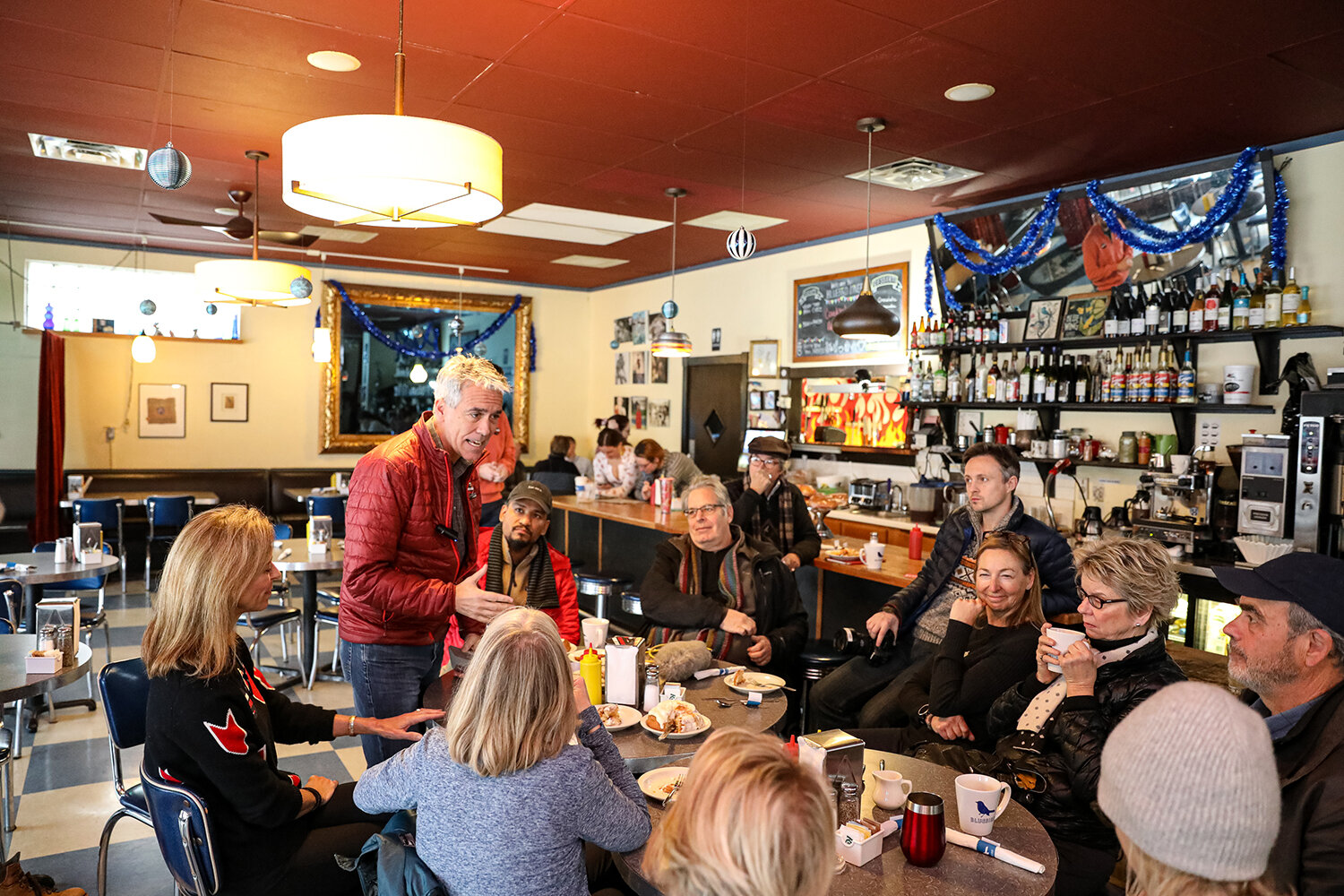  Former congressman and Republican Presidential Candidate Joe Walsh talks to diners during a candidate meet and greet at the Bluebird Diner in Iowa City, IA on Wednesday, Jan 29, 2020. Most of the diners at the table are members of members of a group