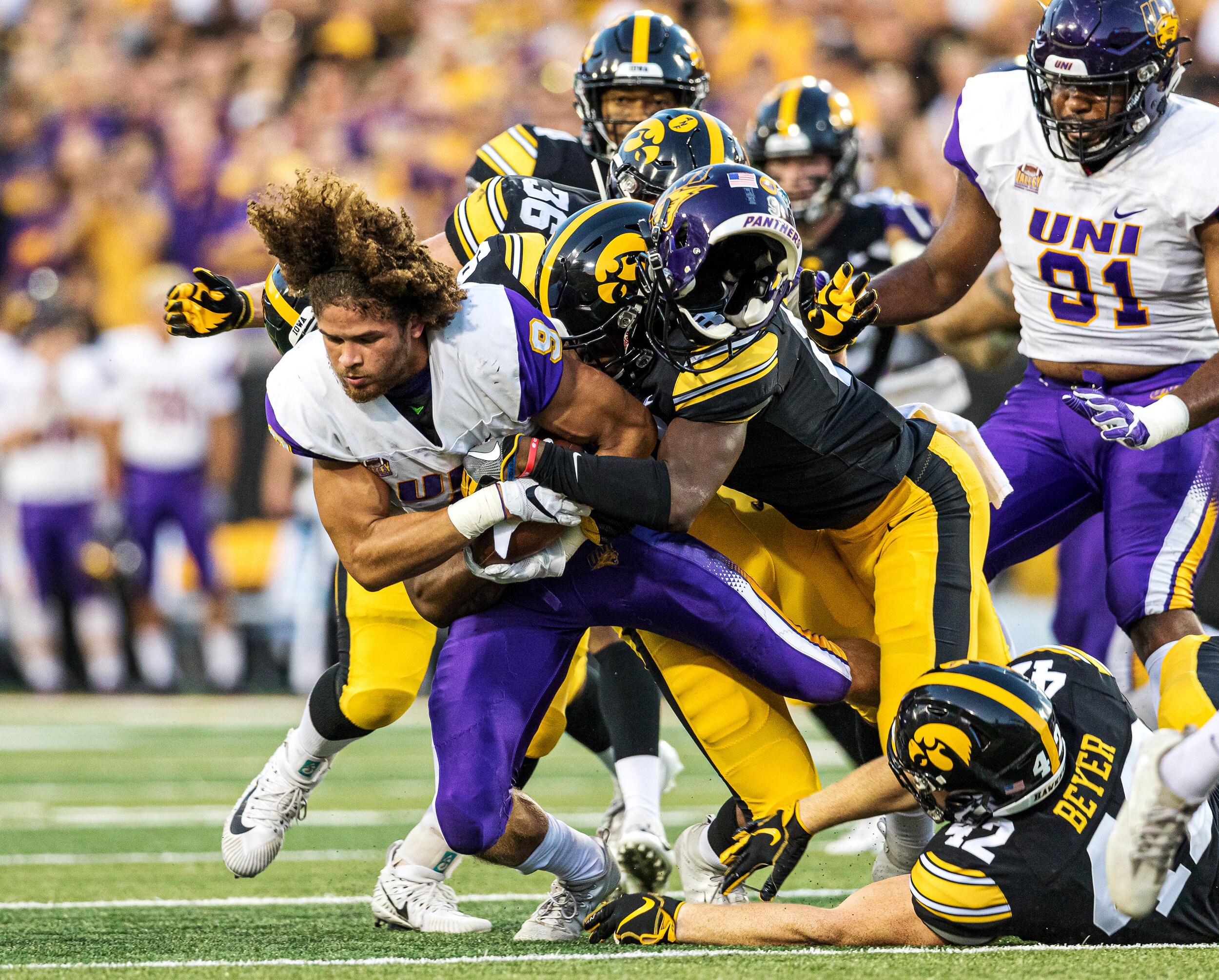  Northern Iowa Panthers punt returner Xavior Williams (9) loses his helmet as he is tackled during a game against Northern Iowa at Kinnick Stadium on Saturday, Sep. 15, 2018. The Hawkeyes defeated the Panthers 38–14.  