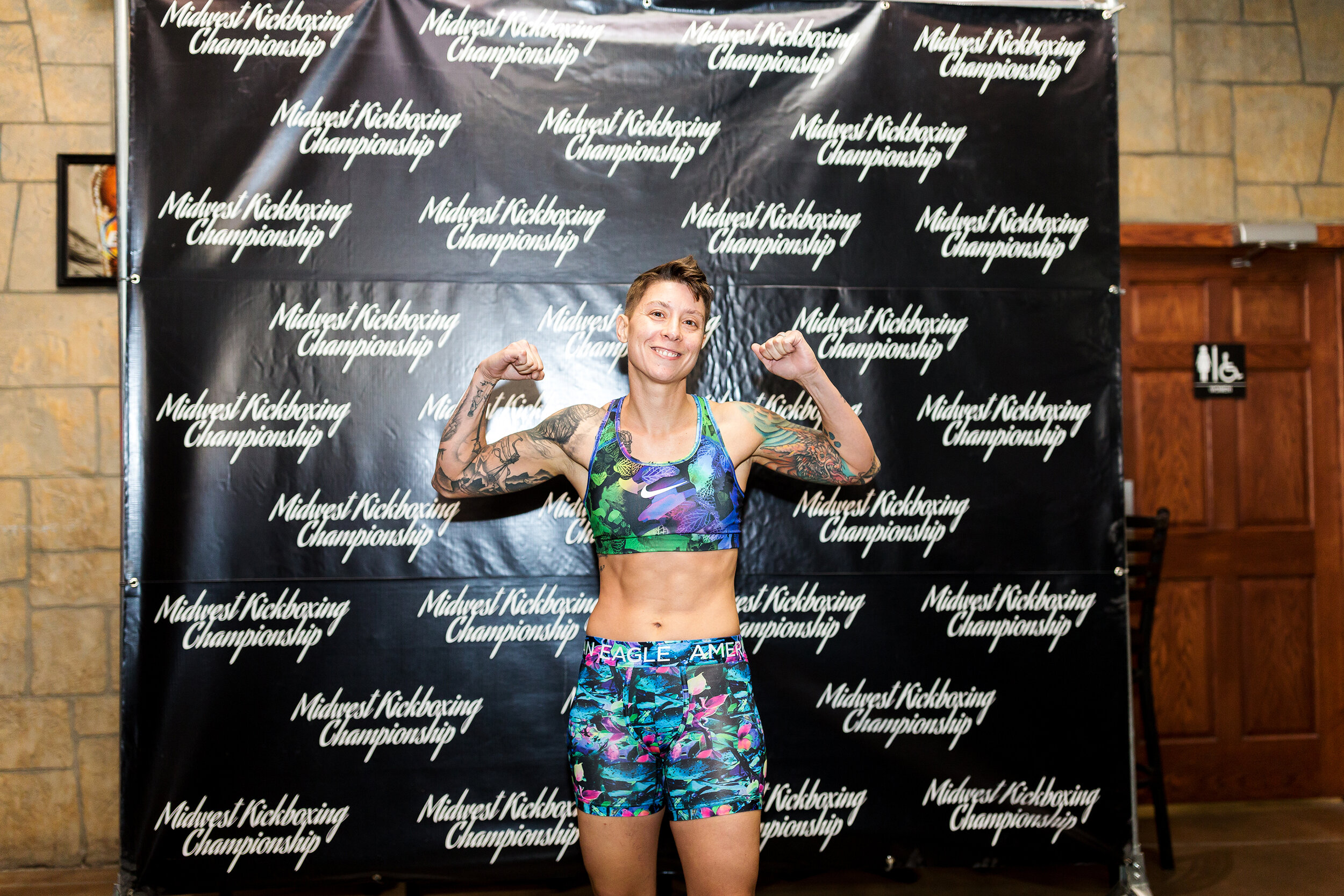  Kickboxer Liz Helton poses for photos after weighing in for the 130lb weight class before the Midwest Kickboxing Championship at Aces and Eights Saloon in Cedar Rapids, IA on Aug. 17, 2018. 