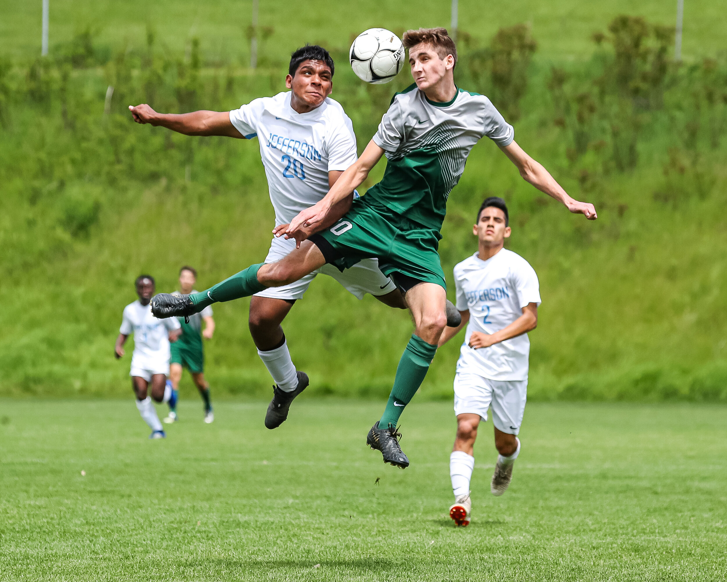  Cedar Rapids Jefferson’s Nestor Diaz (20) and Iowa City West’s Matthew McDonnell (10) battle for control of the ball during the boys soccer substate semifinal at Iowa City West High School in Iowa City on Saturday, May 25, 2019. 