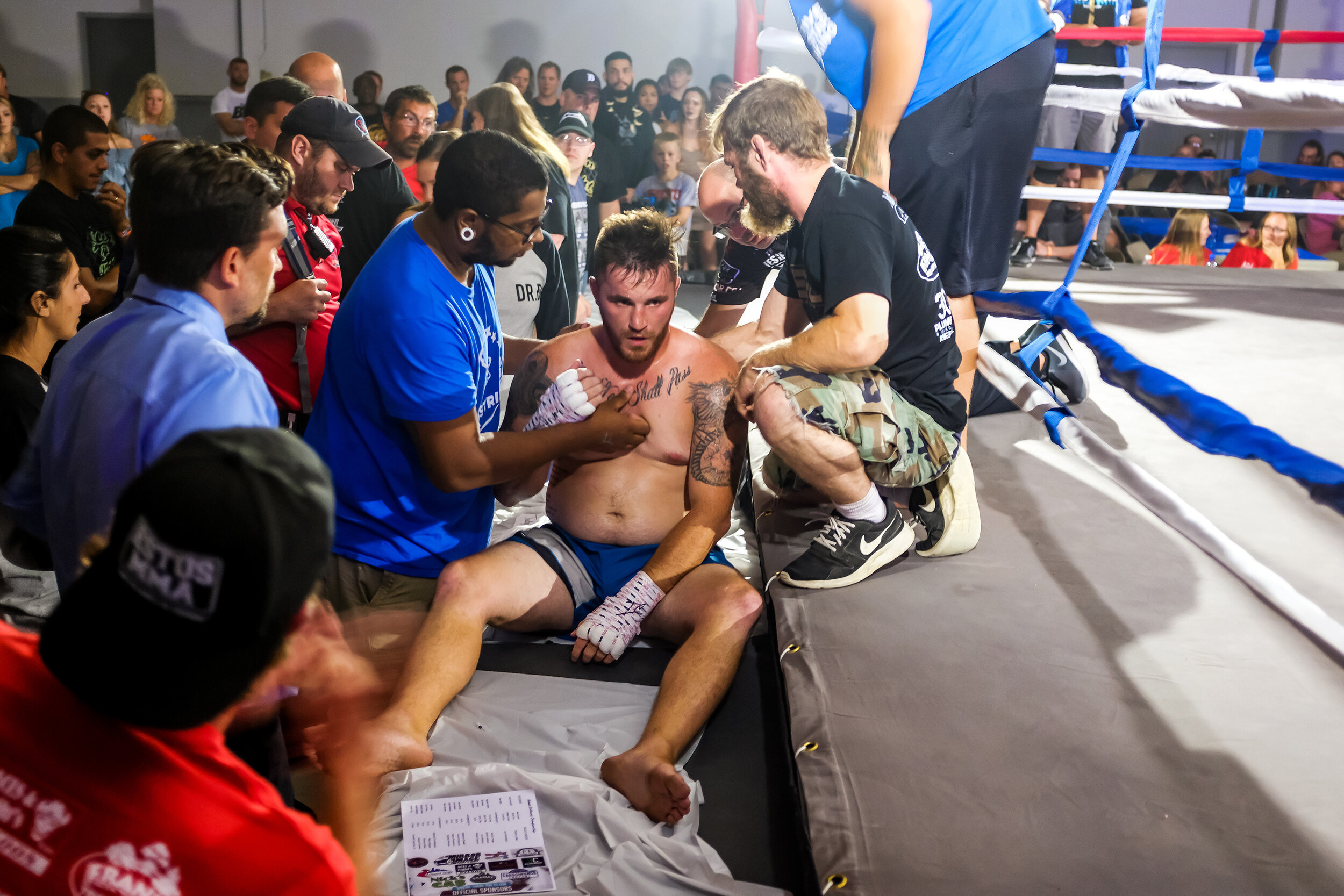  Kickboxer Derek Lofer is helped up after being knocked out the ring during his match against Dan Hornbuckle in the 185lb pro weight category in the Midwest Kickboxing Championship at the Teamsters Union Hall in Cedar Rapids, IA on Aug 18, 2018. Horn