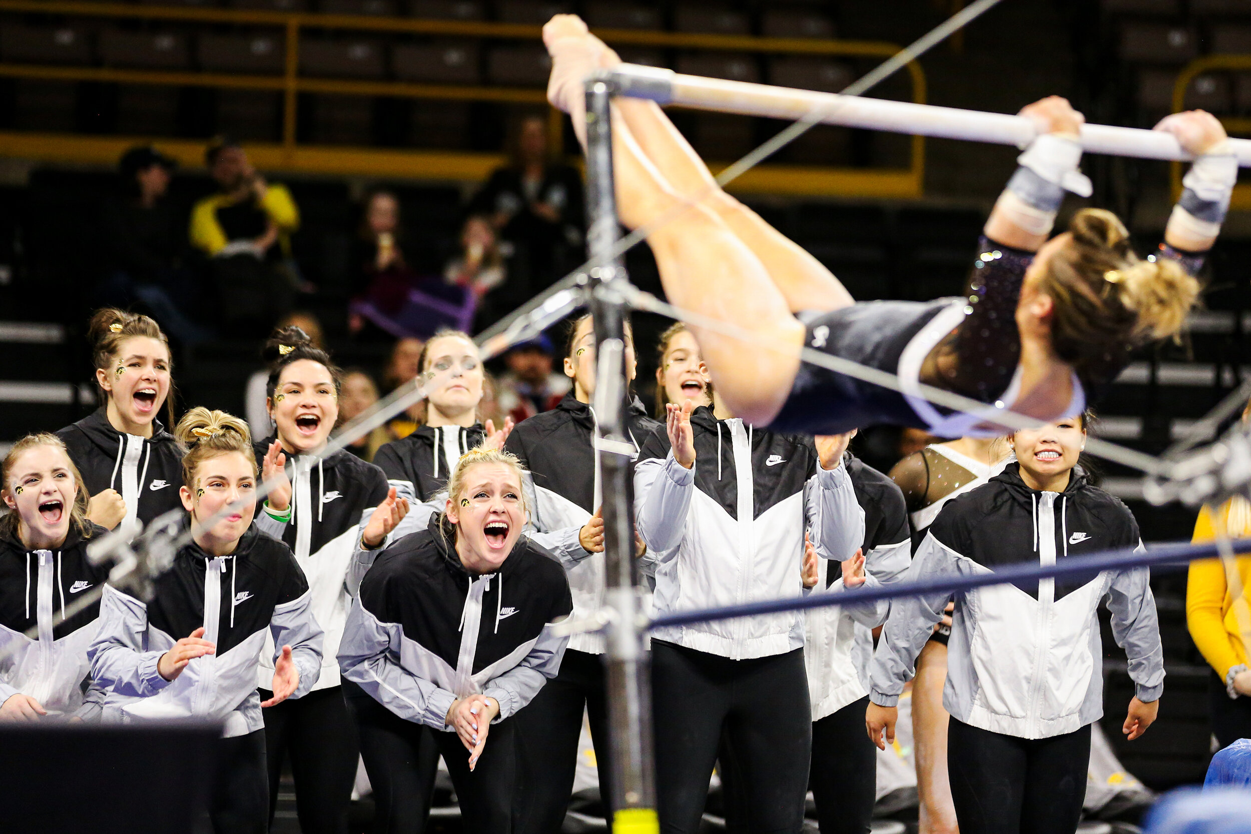  Members of the University of Iowa Women’s Gymnastics Team cheer on teammate Maggie Kampschroeder as she competes on the uneven bars during a gymnastics meet against Rutgers on Saturday, Jan. 26, 2019. The Hawkeyes defeated the Scarlet Knights 194.57