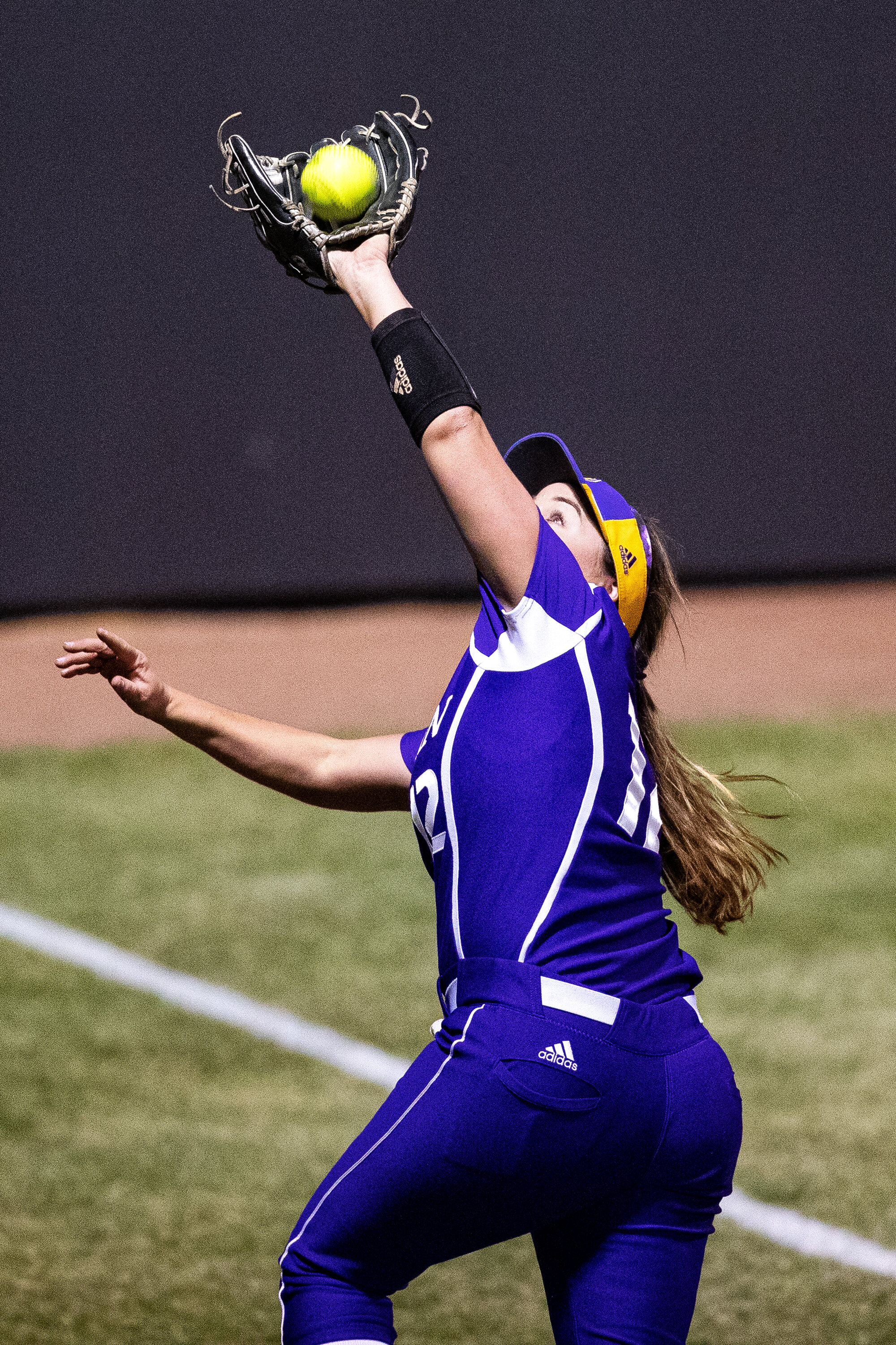  Western Illinois' Aly Compton makes an over-the-shoulder catch in foul territory during a softball game against Iowa on Wednesday, Mar. 27, 2019. The Fighting Leathernecks defeated the Hawkeyes 10-1.  