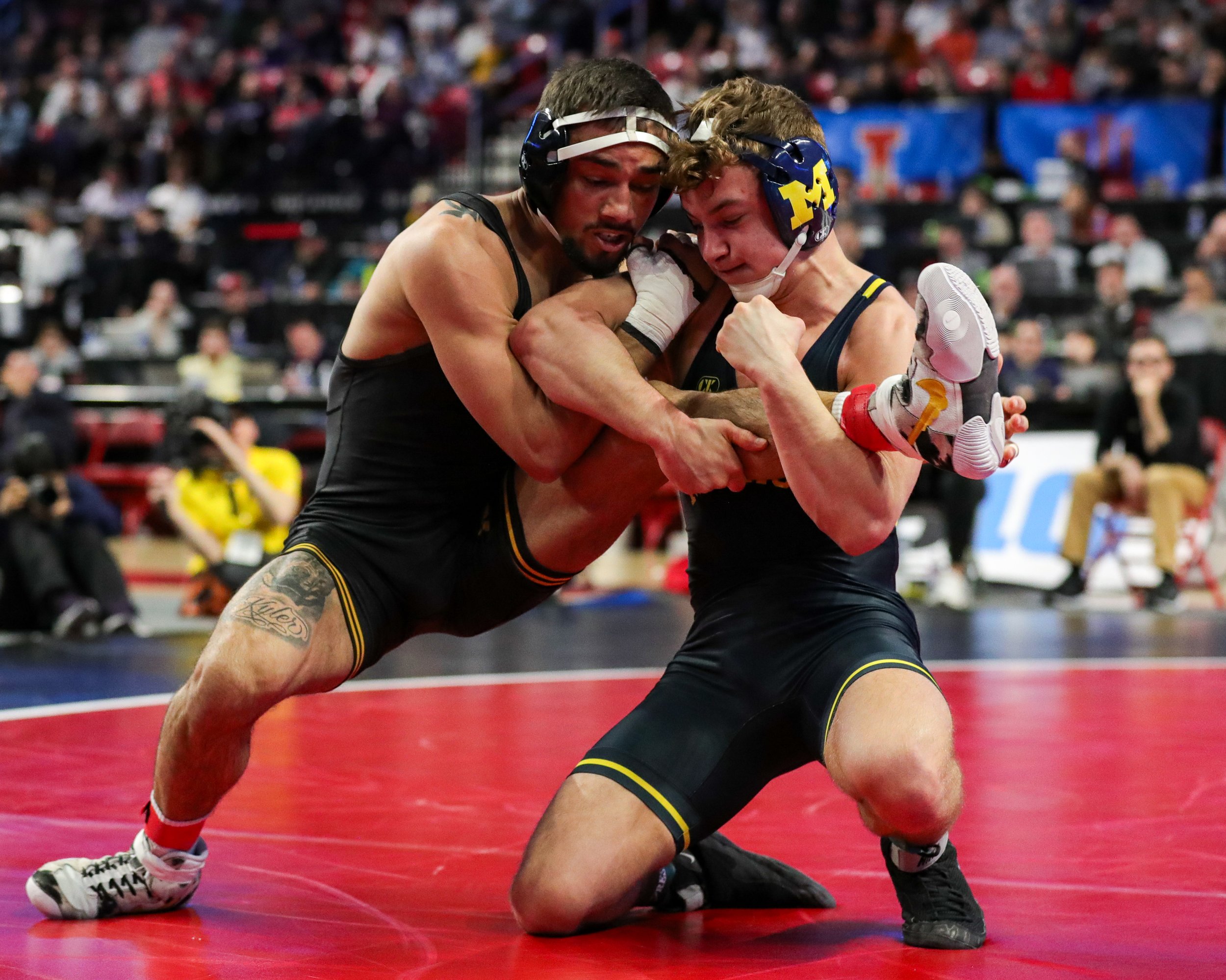  Iowa wrestler Real Woods grapples with Michigan’s Sergio Lemley in a 141-lb third-place match during the Big Ten Wrestling Championships at the Xfinity Center in College Park, Maryland on Sunday, March 10, 2023. Woods won 11-8. (David Harmantas/For 