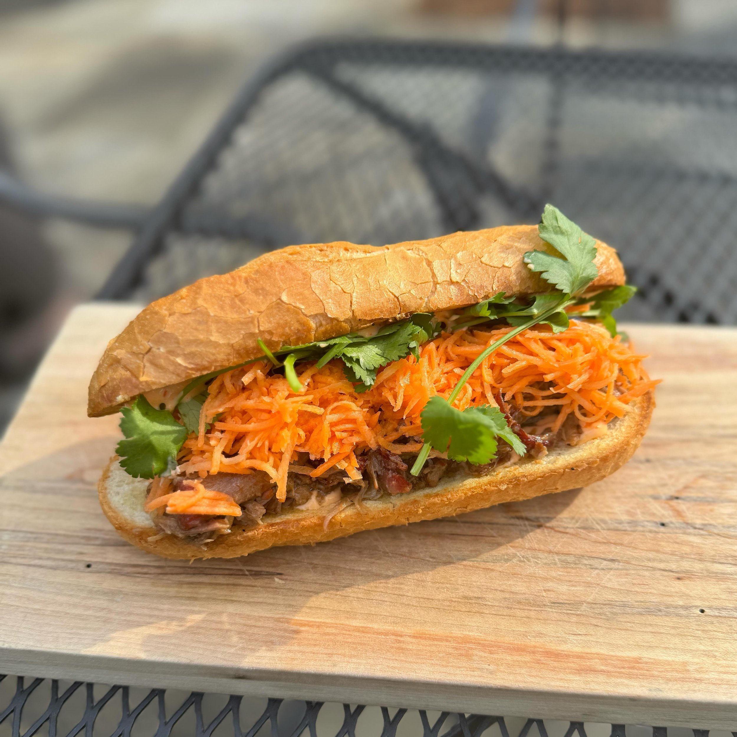 Ginger braised pork b&aacute;nh m&igrave; with pickled carrots, jalape&ntilde;os, cilantro, and spicy aioli! 

🥖😋

Available today and tomorrow from 10am-3pm.