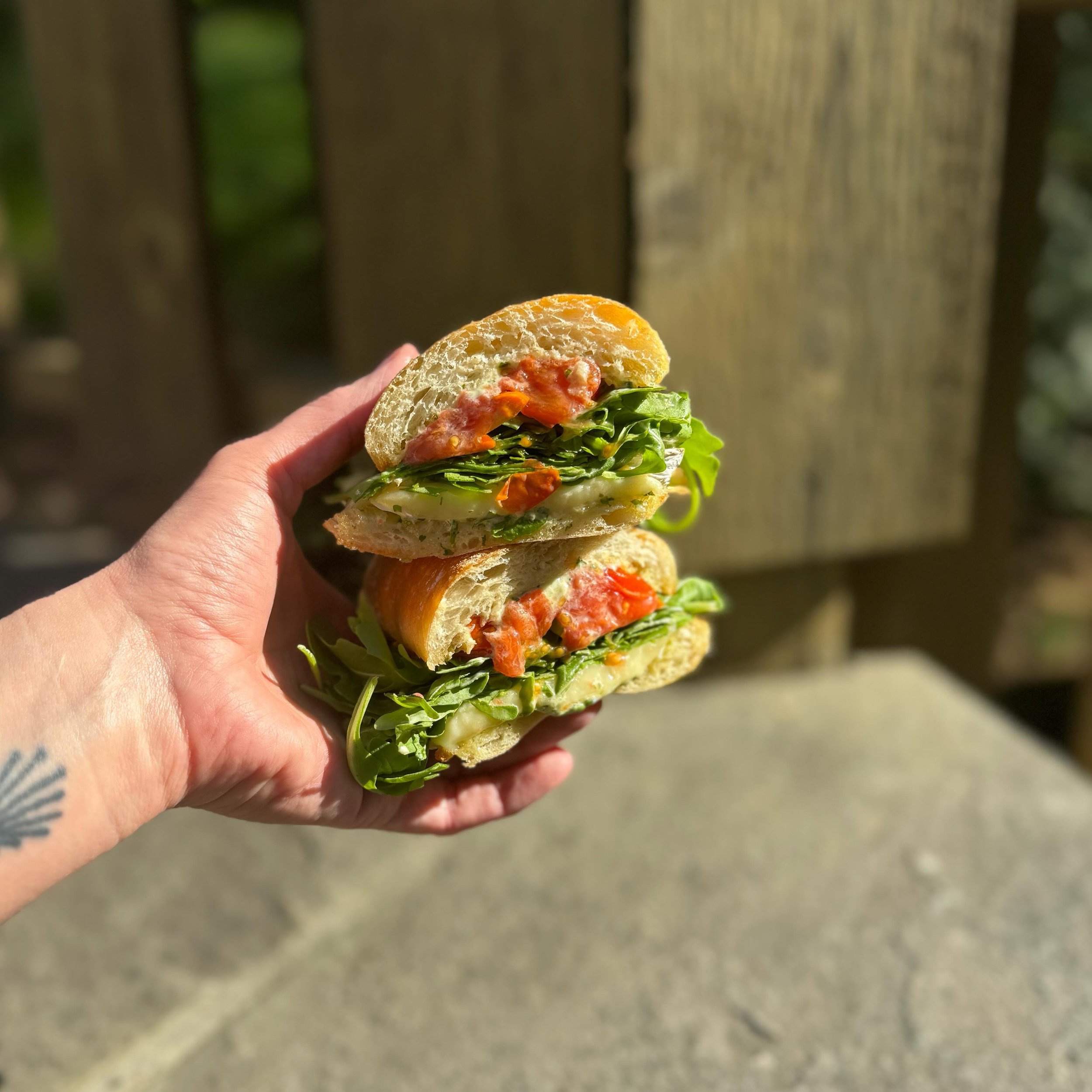 Warm brie and roasted cherry tomato sandwich today! With pesto aioli, arugula, and aged balsamic on butter toasted baguette.

Available today and tomorrow till 3pm!