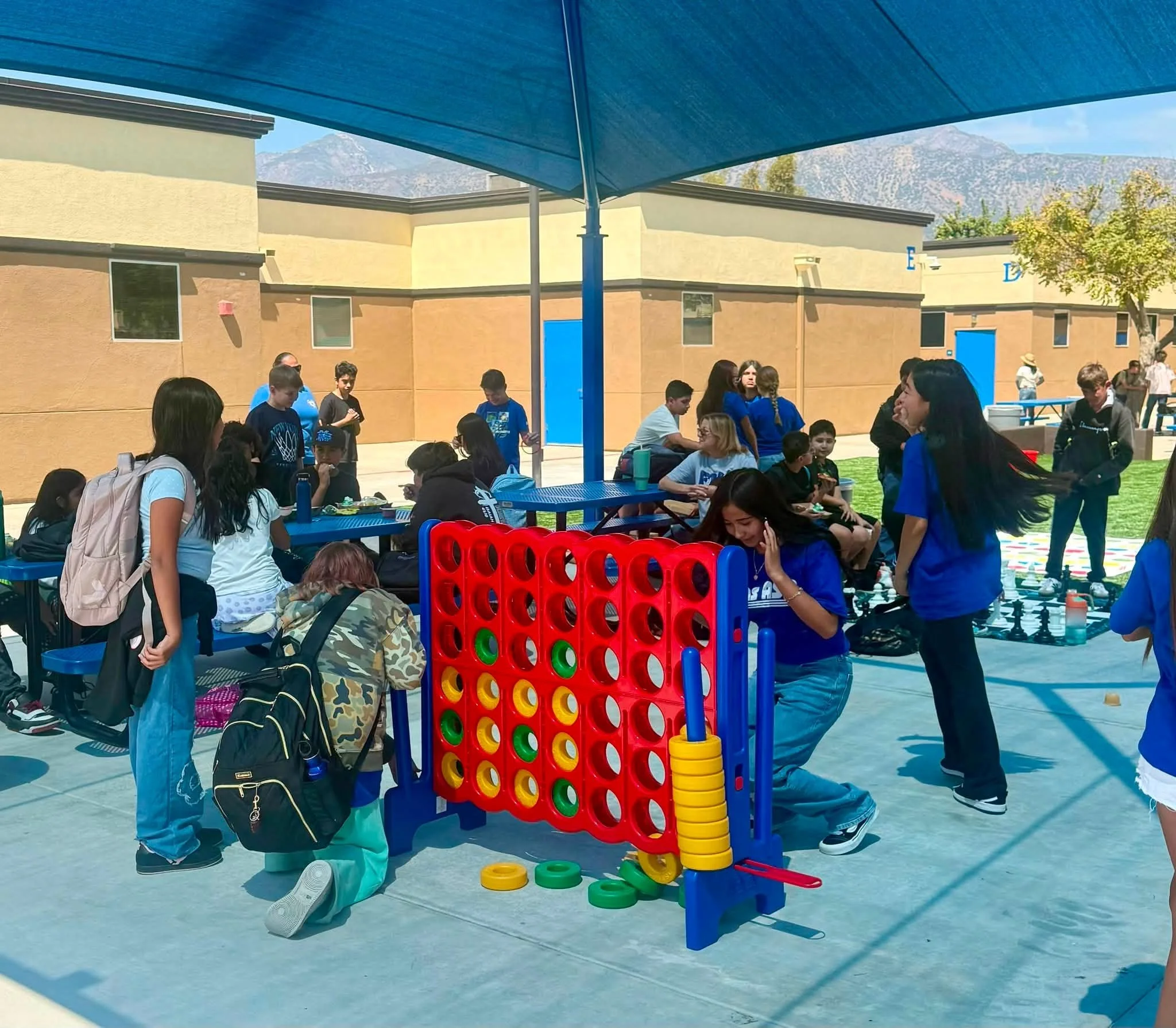 Students play a giant four-in-a-row game during Fun Friday.