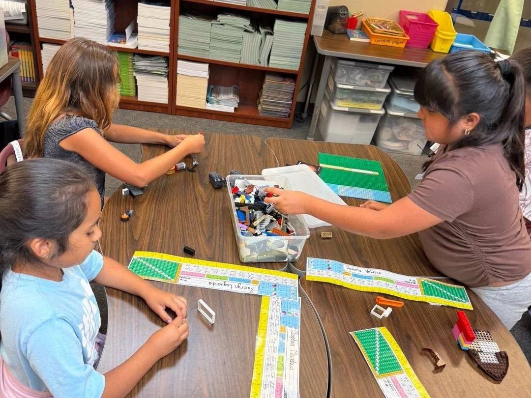 Students work together during a hands-on LEGO activity.