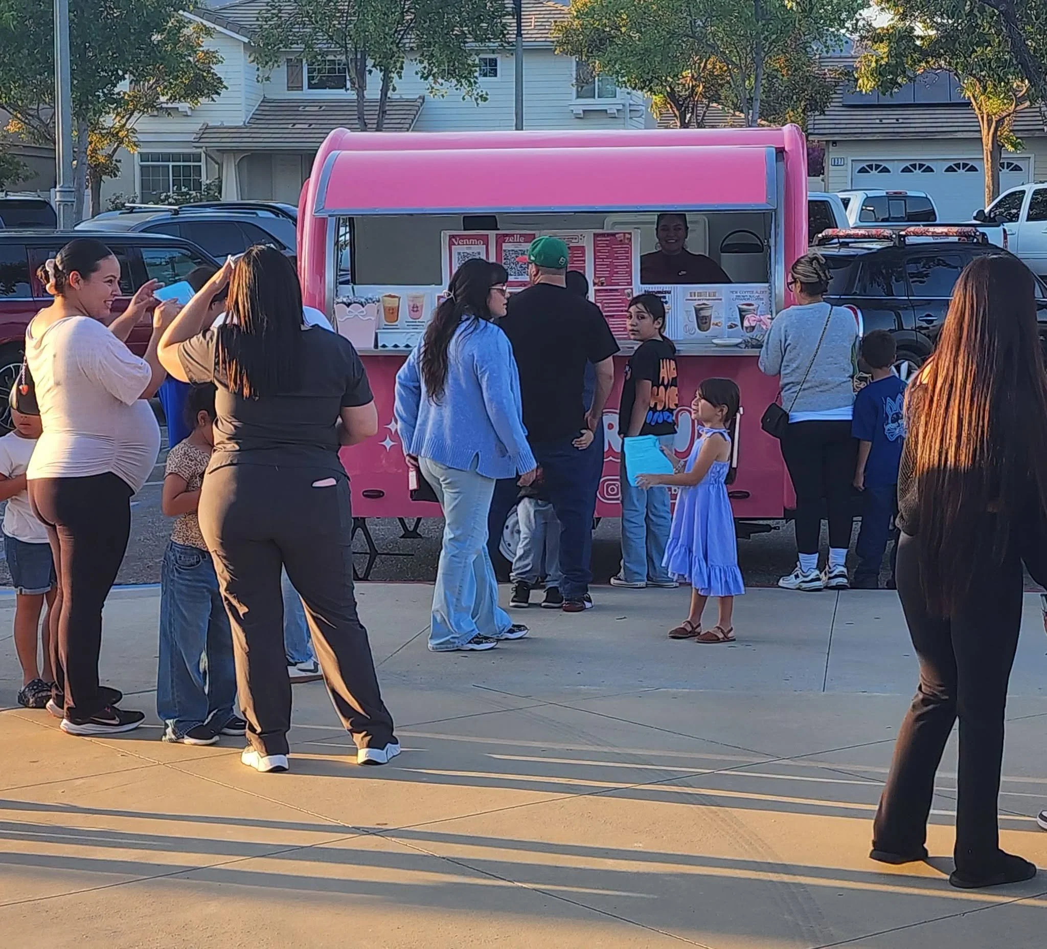 Wildcat families gather at a pink refreshment truck outside Mountain Vista Elementary.