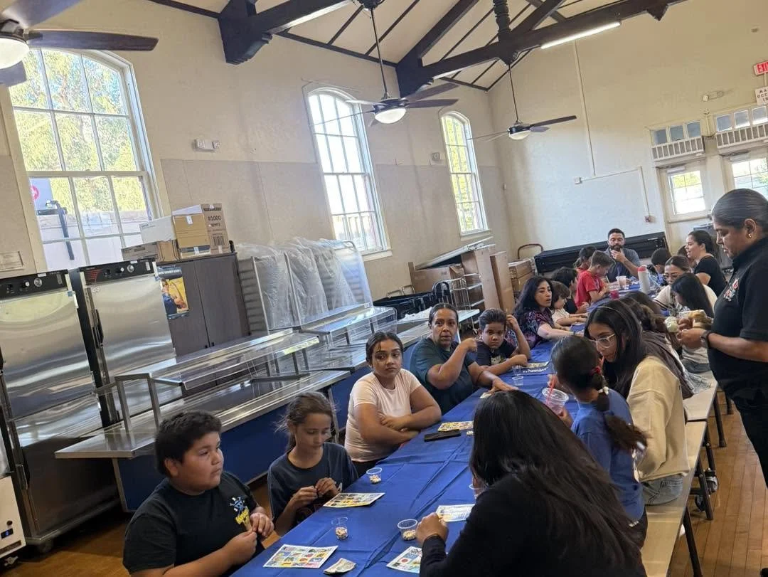 A Piru family marks a Lotería card during the school event.