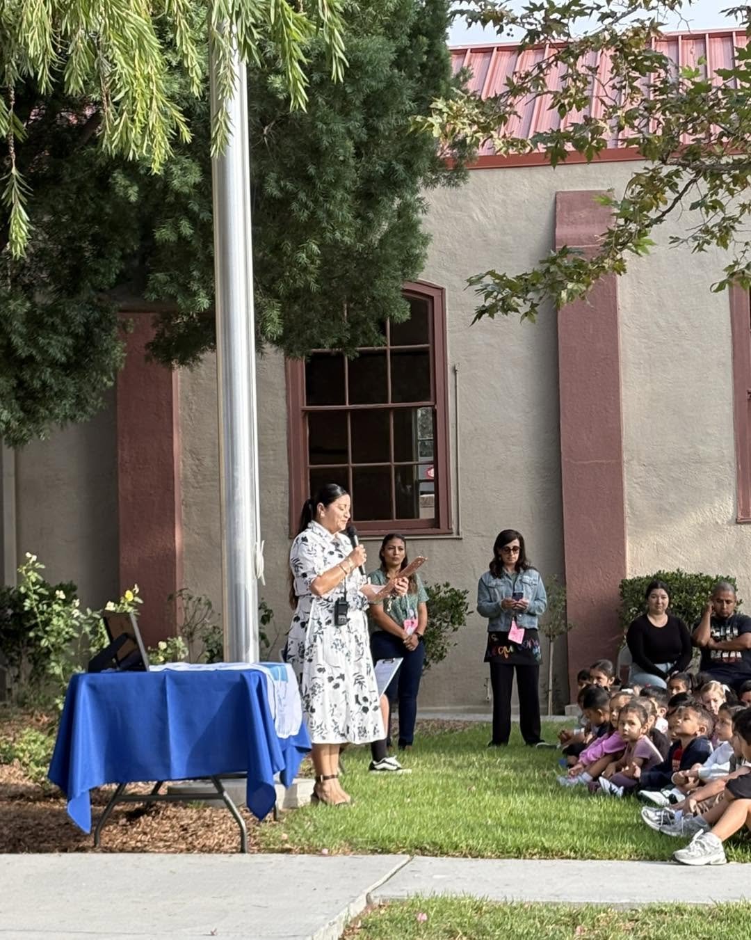 Piru students watch the Promising Practices flag ceremony.