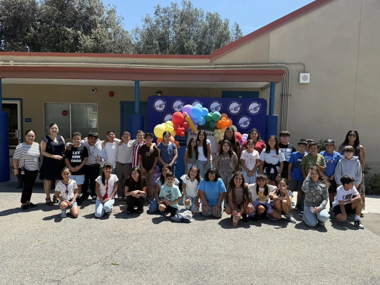 A class and staff gather for a first-day group photo outside Piru Elementary.