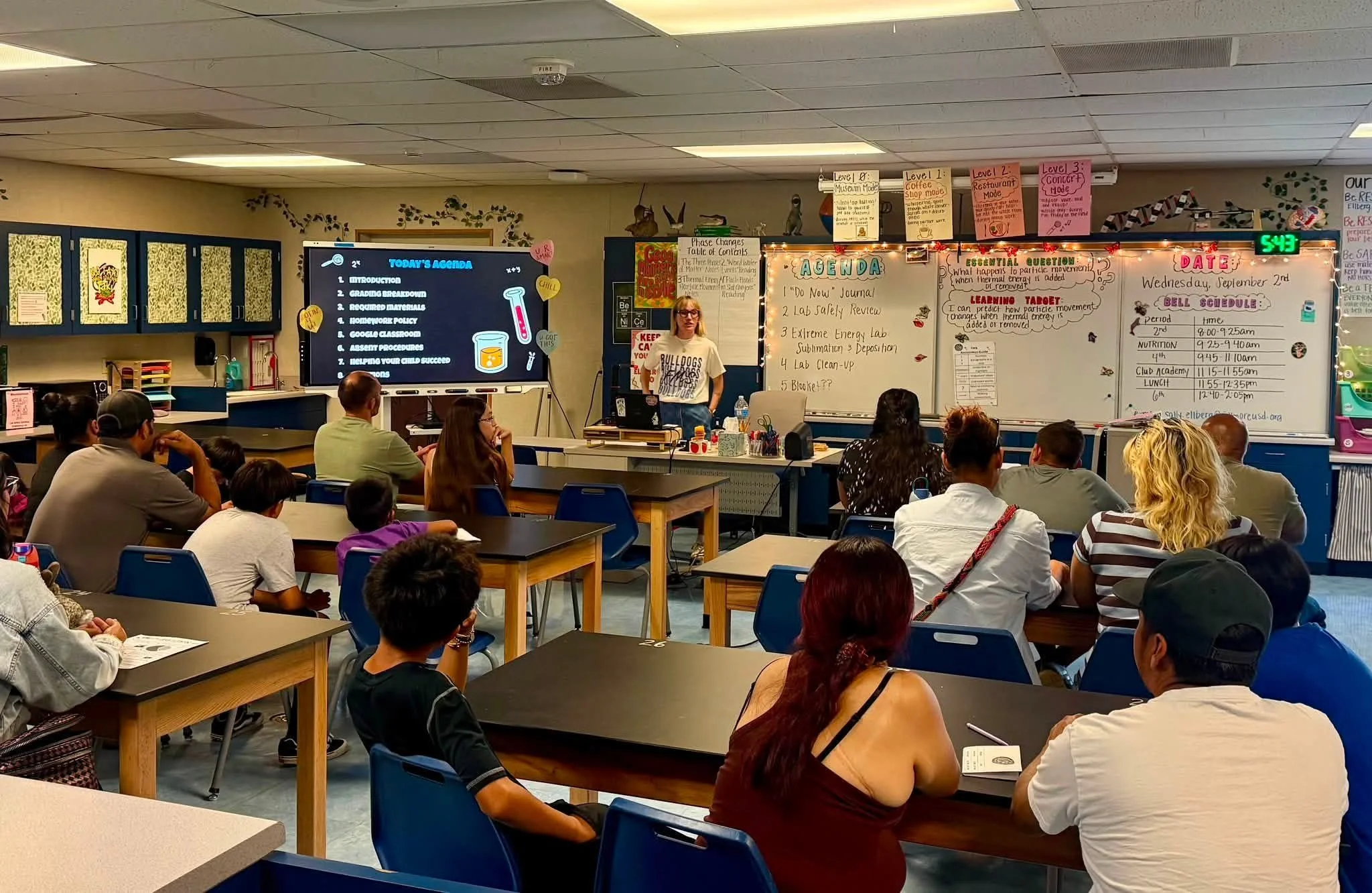 A science teacher presents classroom expectations to Bulldog families during Back to School Night.