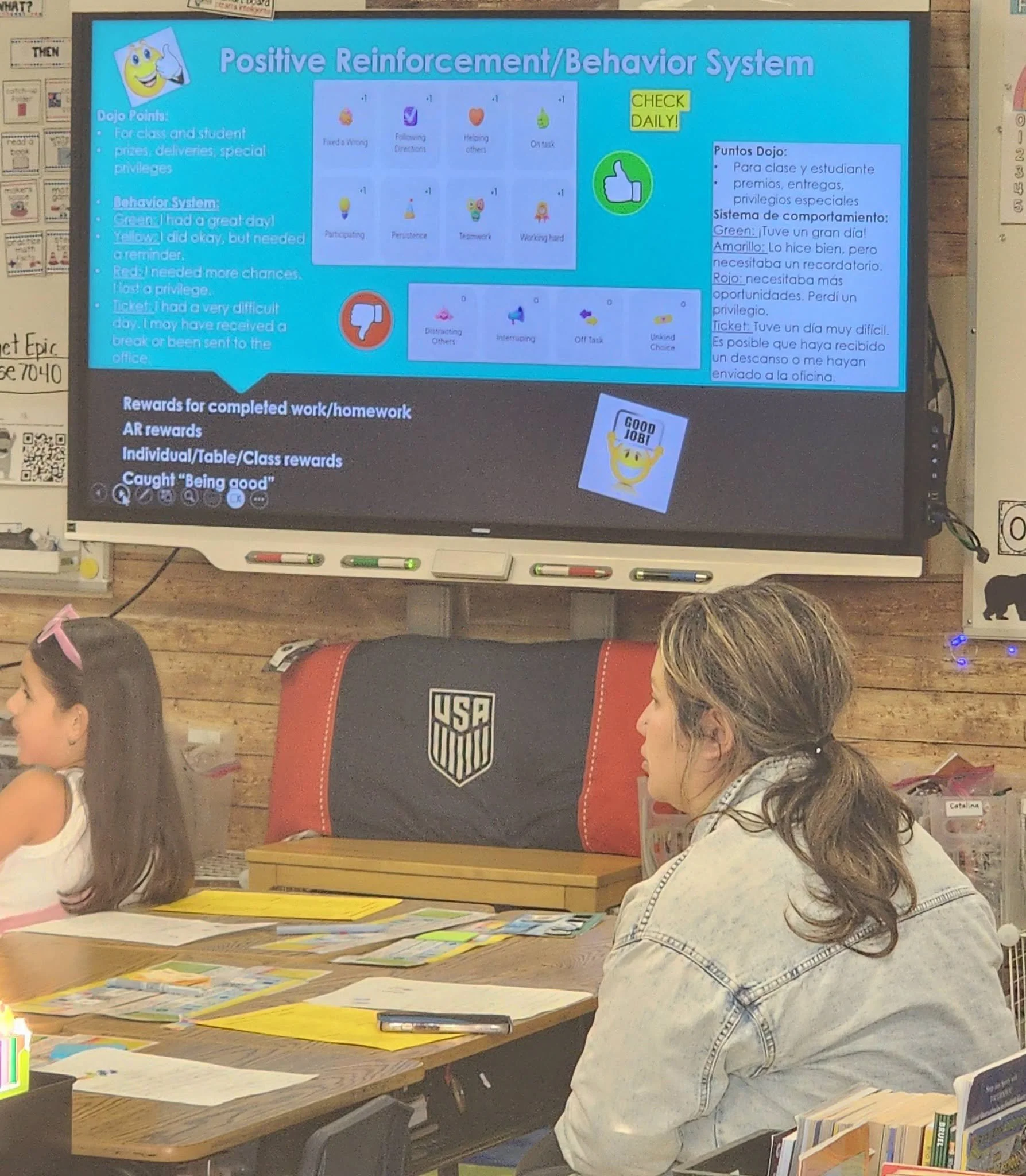 A Wildcat family member listens to a presentation about the classroom behavior system.