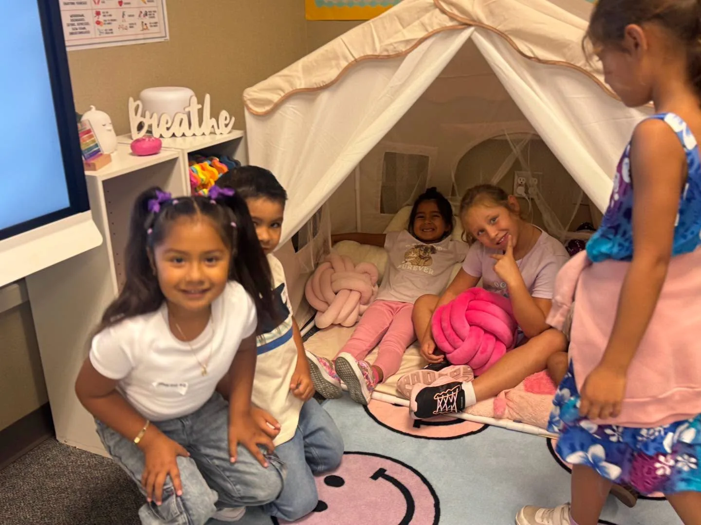 Students explore the small tent and pillows in the Wellness Center.