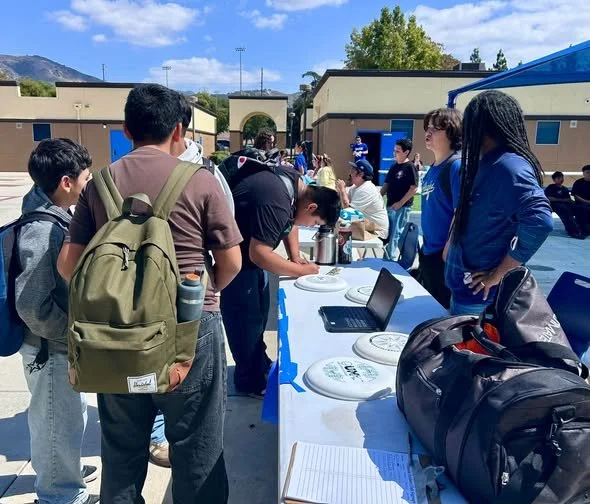 Students talk with club representatives during Club Rush at FMS.