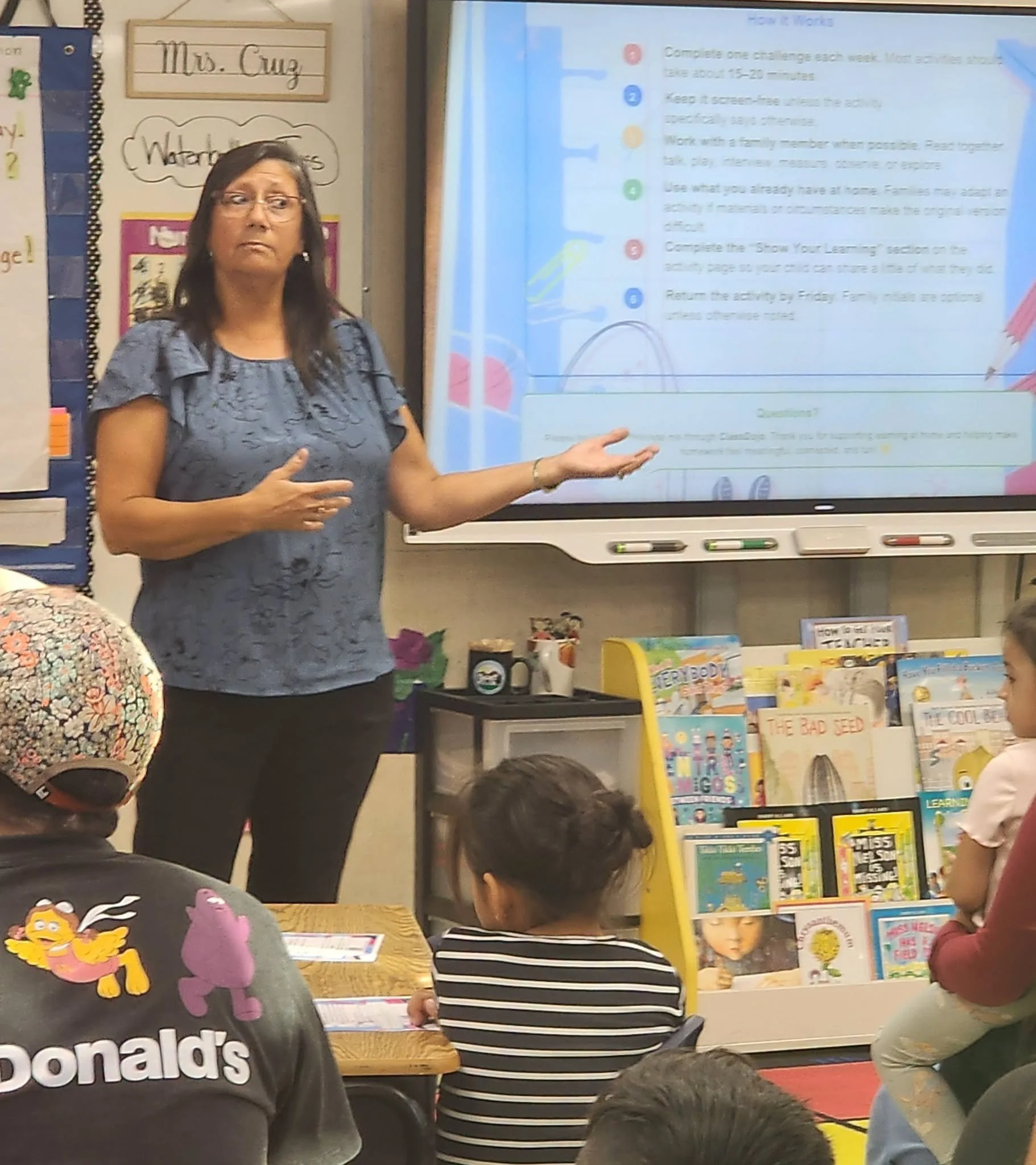 A Mountain Vista teacher presents weekly homework information to Wildcat families.