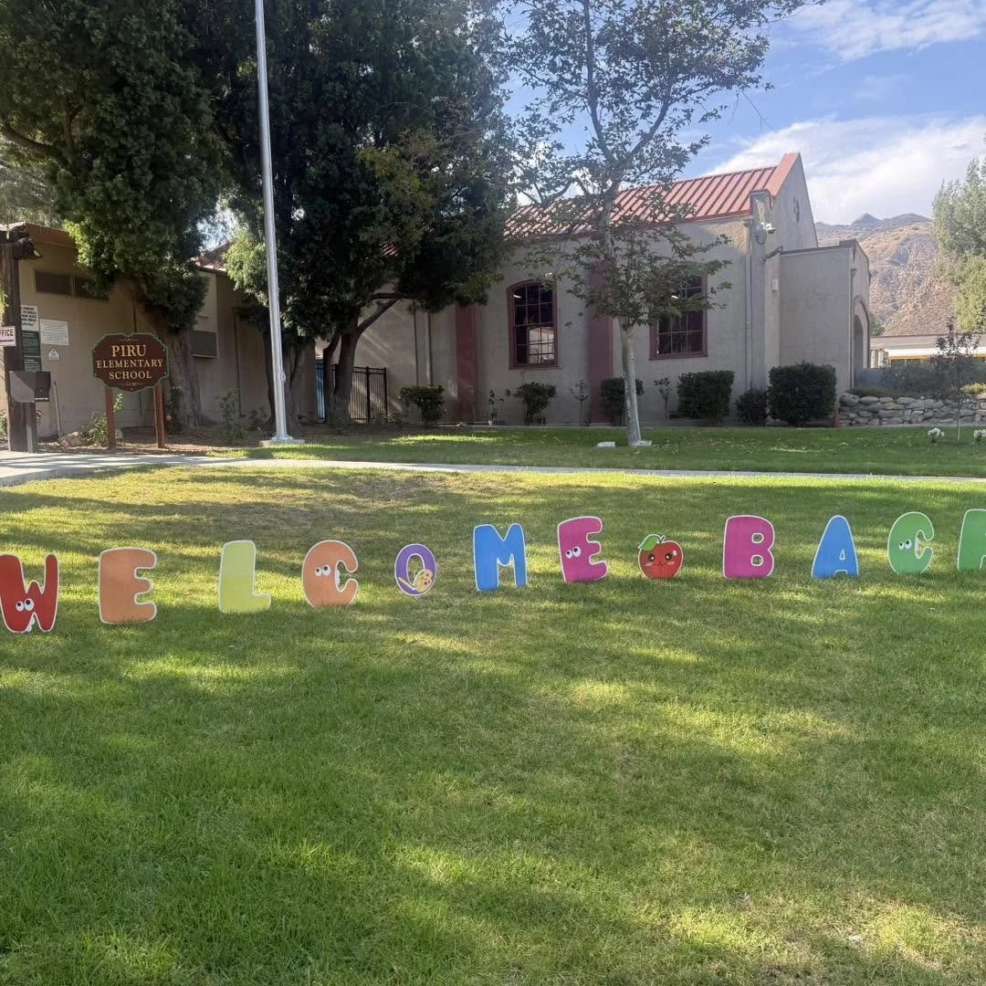 Colorful welcome-back letters decorate the lawn outside Piru Elementary School.