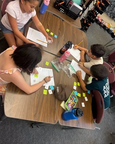 Students in Mrs. Lamiell’s class practice decoding with affixes.