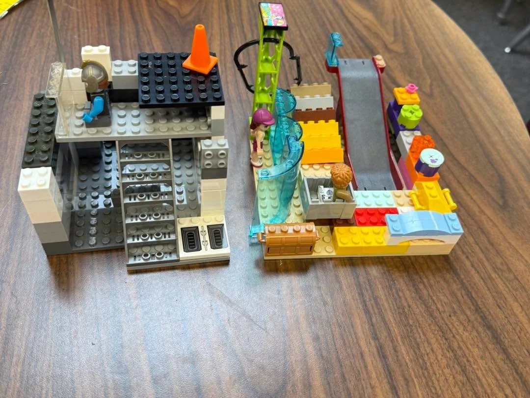 A Roadrunner proudly displays a LEGO creation.
