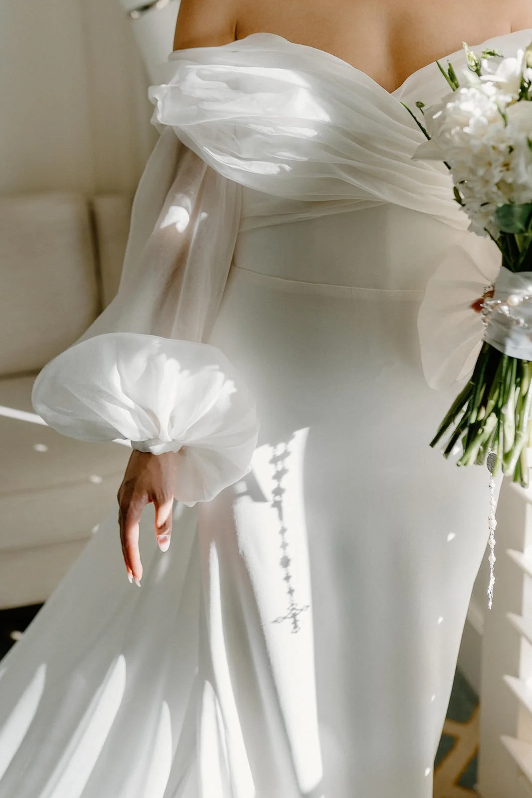 Close-up of a bride in a white wedding dress holding a bouquet of white flowers. Hunter Valley wedding photographer couple portrait
Bowral wedding cinematography vineyard film still
Newcastle wedding candid moment natural storytelling