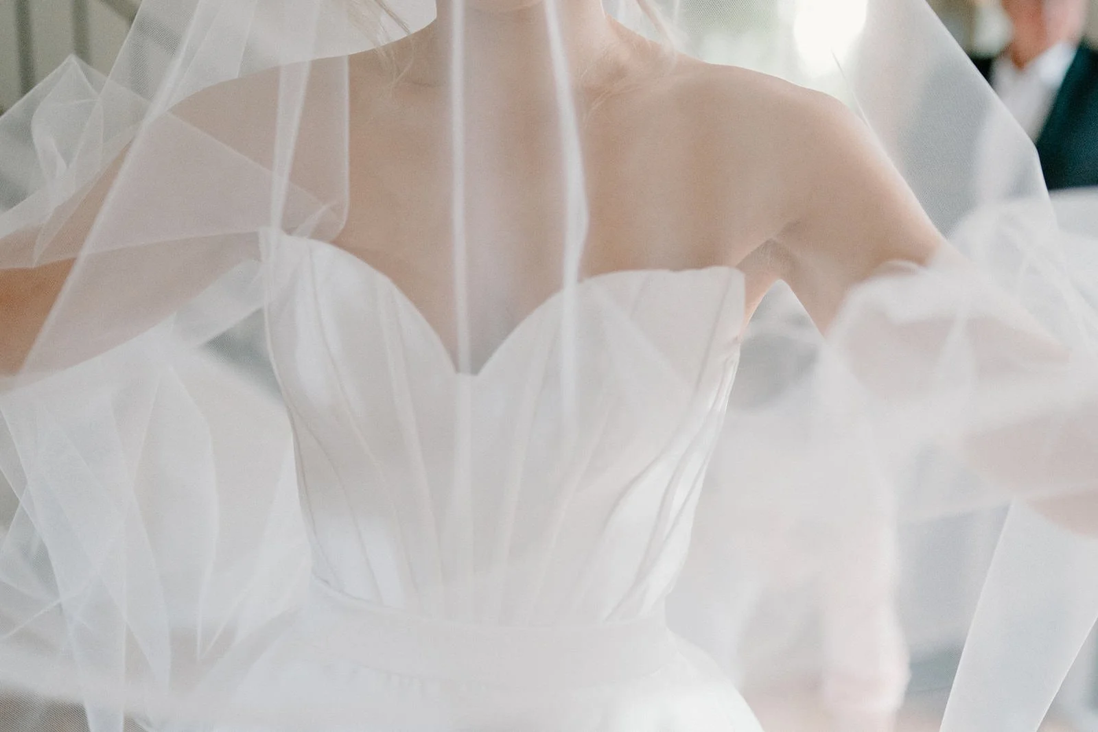Close-up of a bride in a white wedding dress with a sheer veil covering her shoulders and face. Hunter Valley wedding photographer couple portrait
Bowral wedding cinematography vineyard film still
Newcastle wedding candid moment natural storytelling