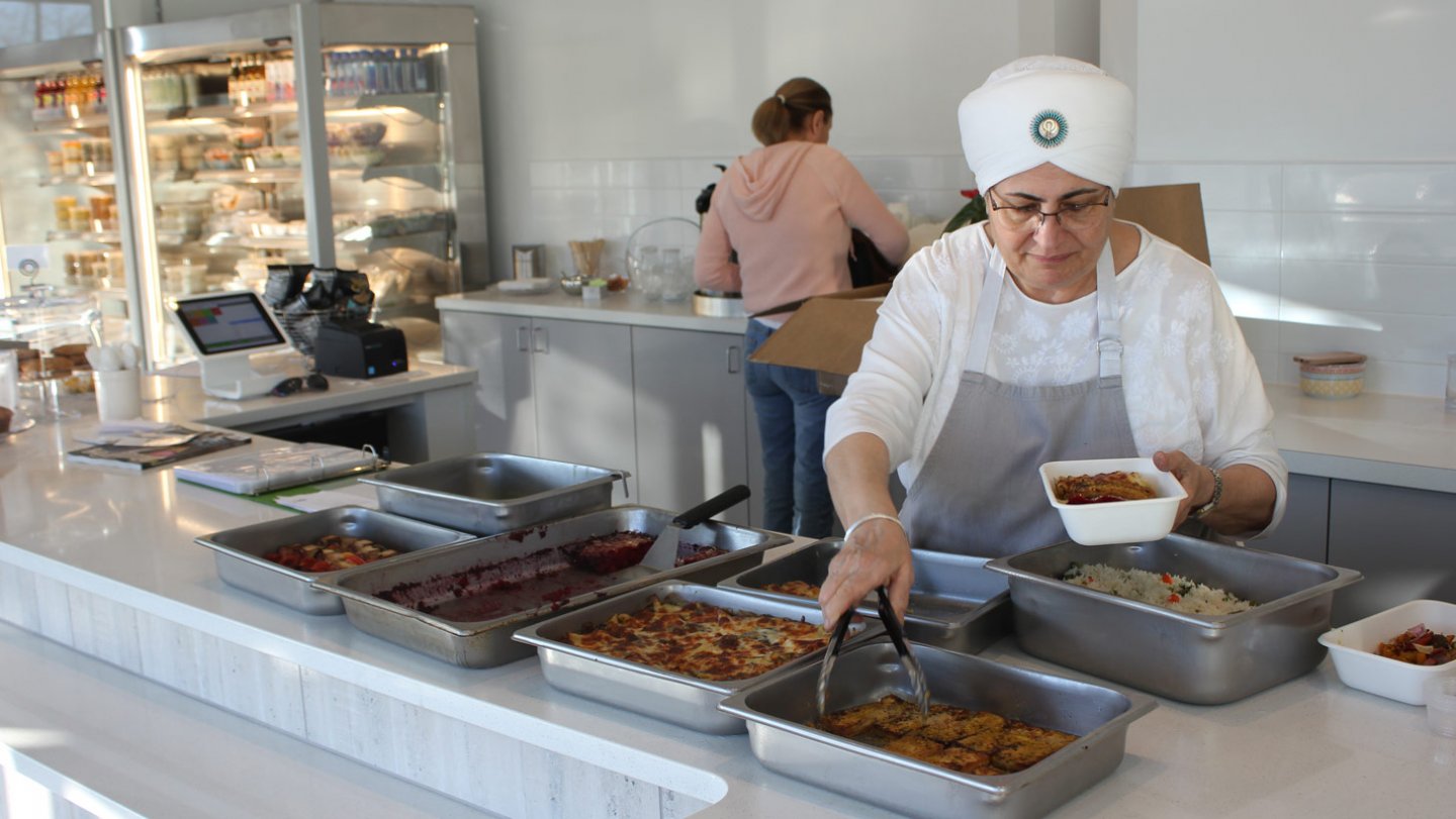 Gurubachan Kaur Khalsa serving the daily special.jpg