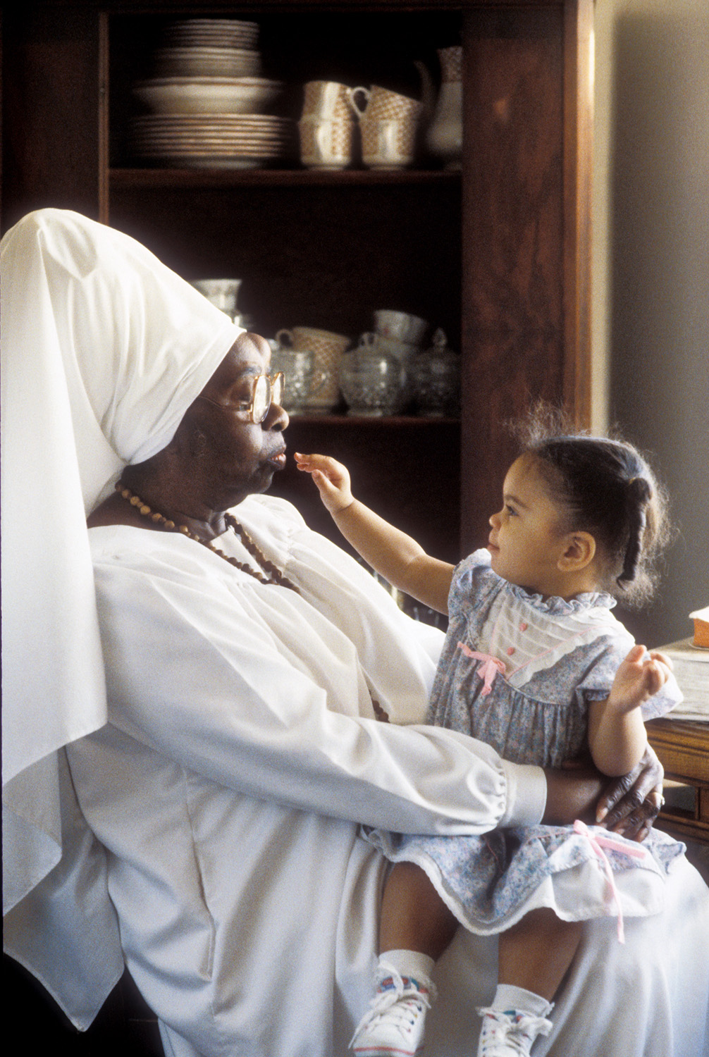  Sister Helen Gay - Sister Gay established a homeless shelter for women and children in the Houston area. At the time of this photo, she had personally adopted 19 orphaned children, 