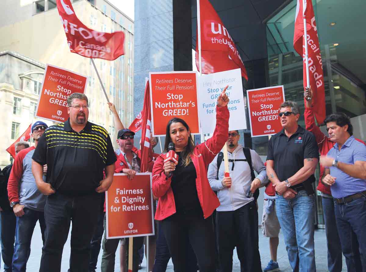 Scott McIlmoyle (left), chairperson, Unifor Ontario Regional Council, and Naureen Rizvi, (right) Unifor Ontario Regional Director, at a Toronto rally supporting workers at Northstar Aerospace, 2017. SUPPLIED
