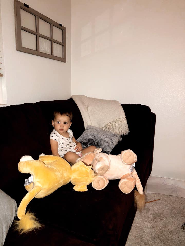 Okay, but how cute is my girl cuddling with Simba and Nala while watching the Lion King?!