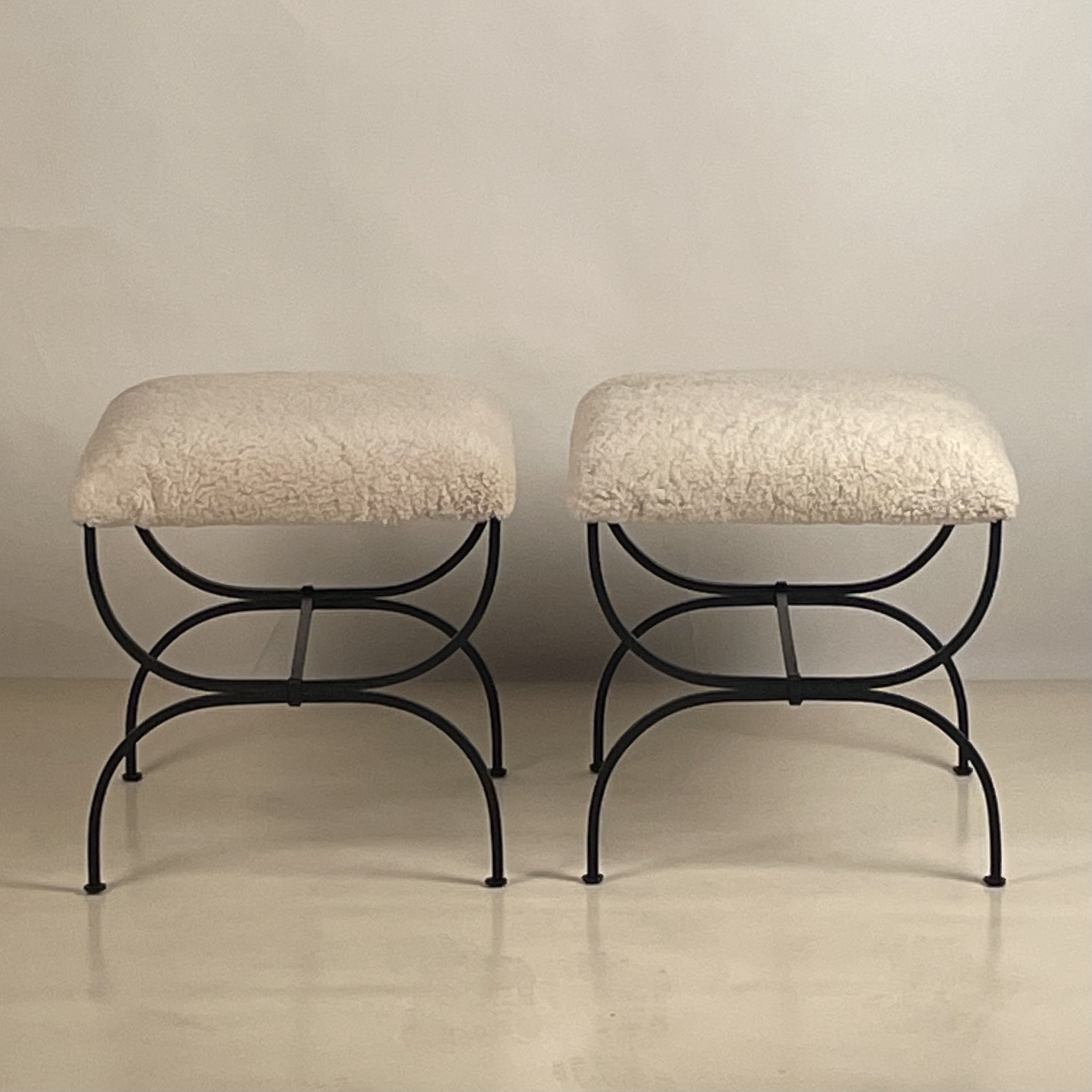 Pair of STRAPONTIN shearling stools.jpeg
